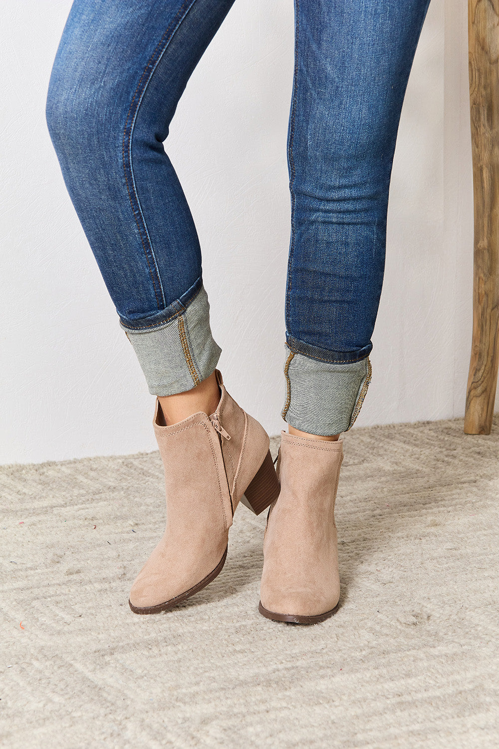 East Lion Corp Block Heel Point Toe Ankle Boots featuring a stylish pointed toe and comfortable block heel, made from faux suede.