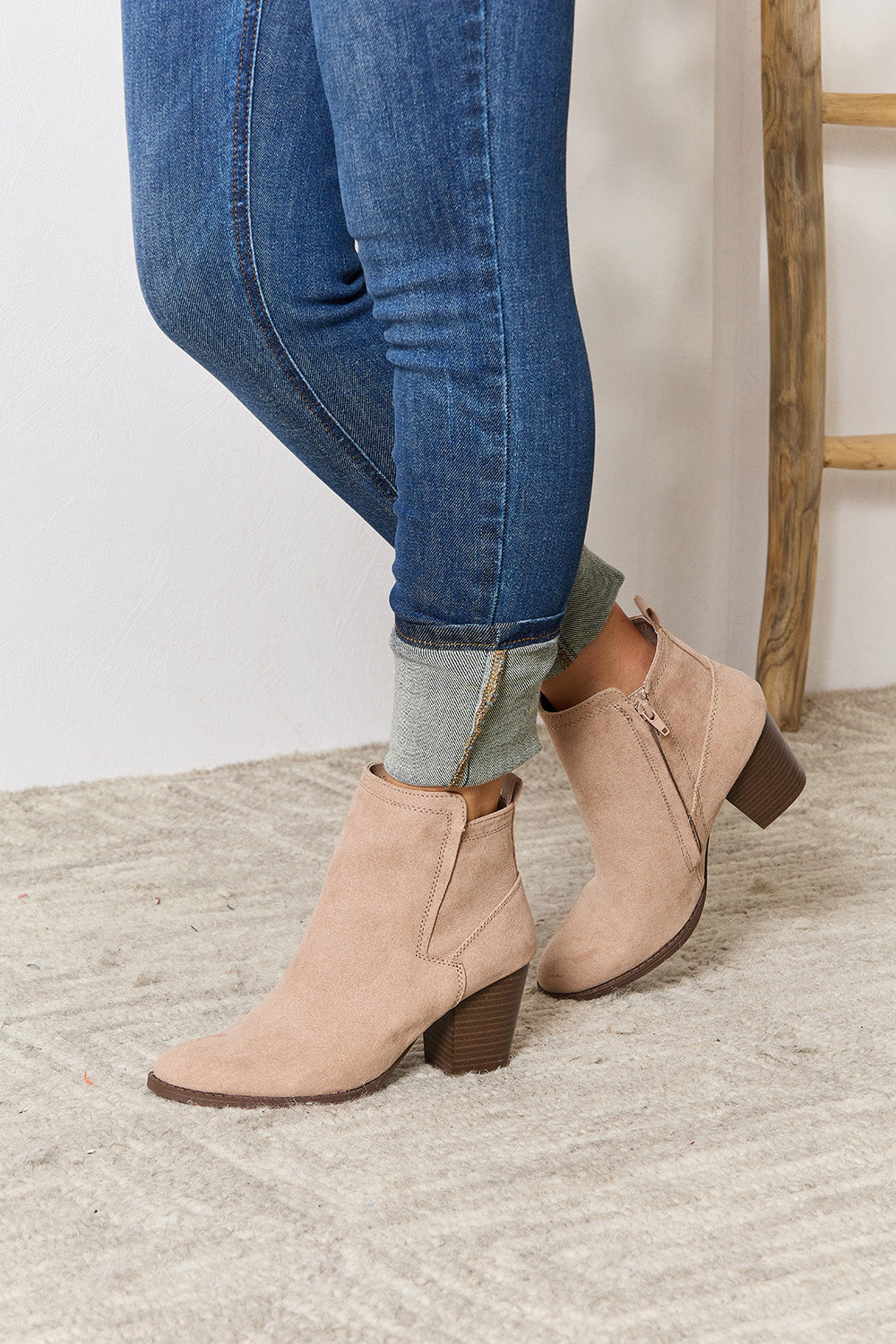 East Lion Corp Block Heel Point Toe Ankle Boots featuring a stylish pointed toe and comfortable block heel, made from faux suede.