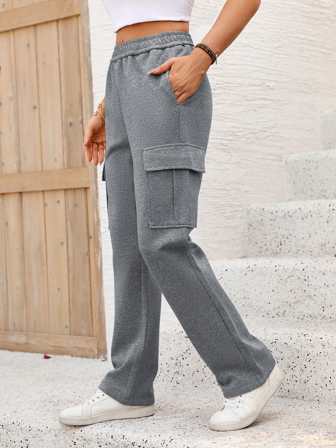 A pair of stylish elastic waist pants with pockets, showcasing a comfortable fit and soft fabric, perfect for casual wear.