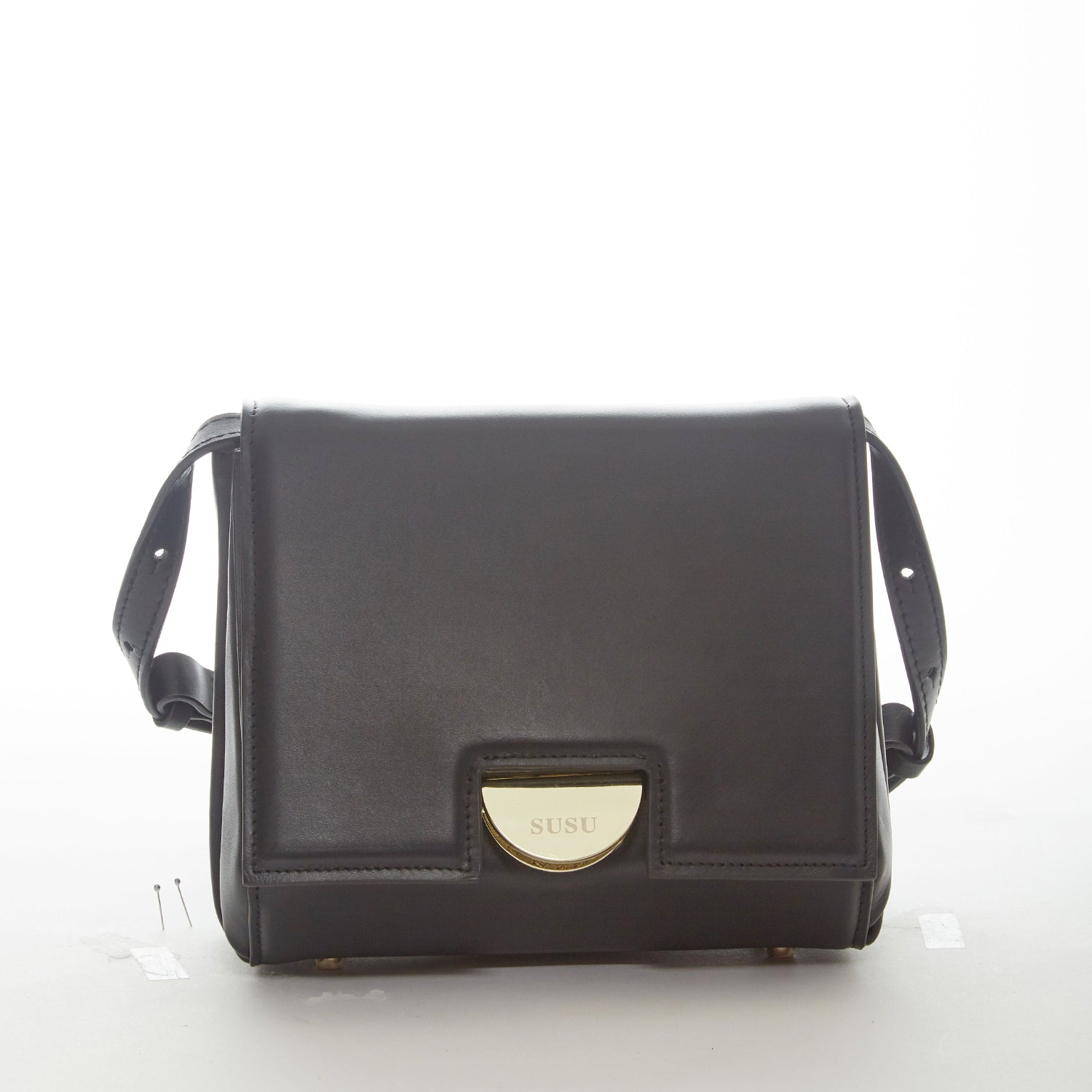 Elizabeth Black Leather Saddle Bag featuring a geometric shape, gold hardware, and adjustable strap, perfect for stylish organization.