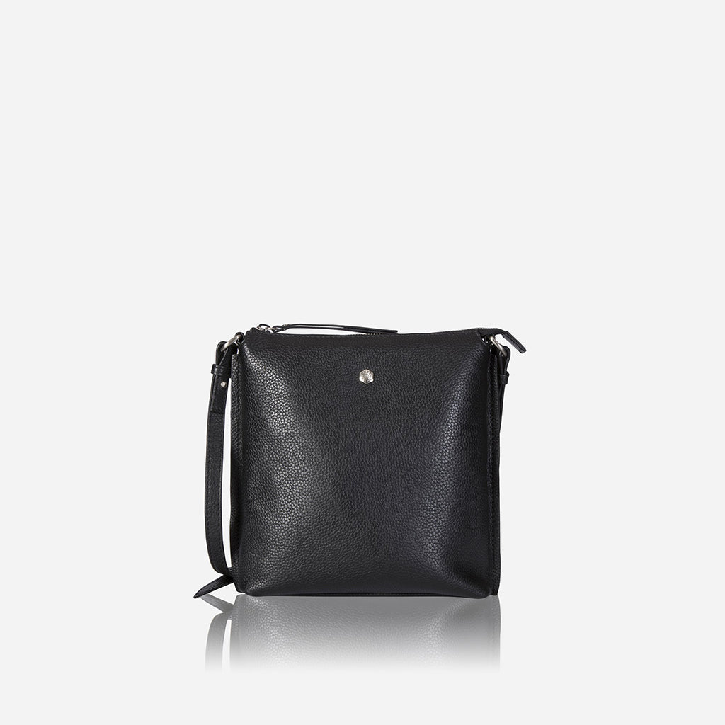 Essentials Crossbody Bag in Black, featuring a sleek leather design, adjustable strap, and spacious interior for essentials.