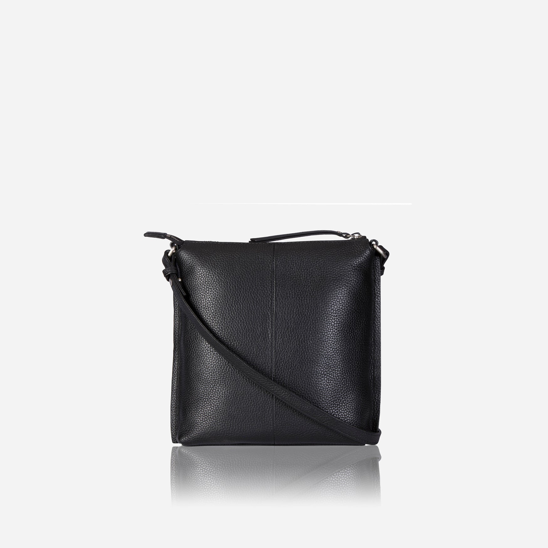 Essentials Crossbody Bag in Black, featuring a sleek leather design, adjustable strap, and spacious interior for essentials.