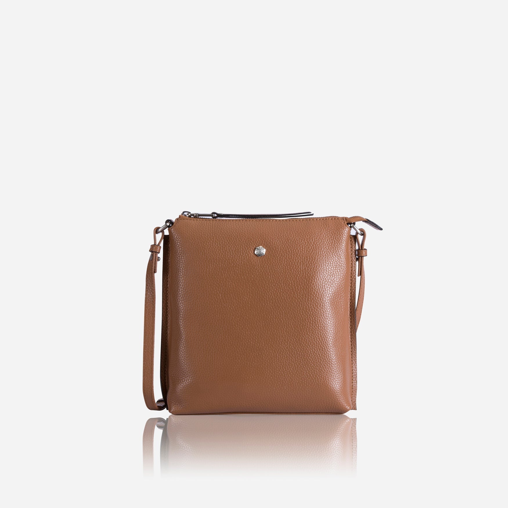 Essentials Crossbody Bag in Tan, featuring a sleek design and adjustable strap for comfort.