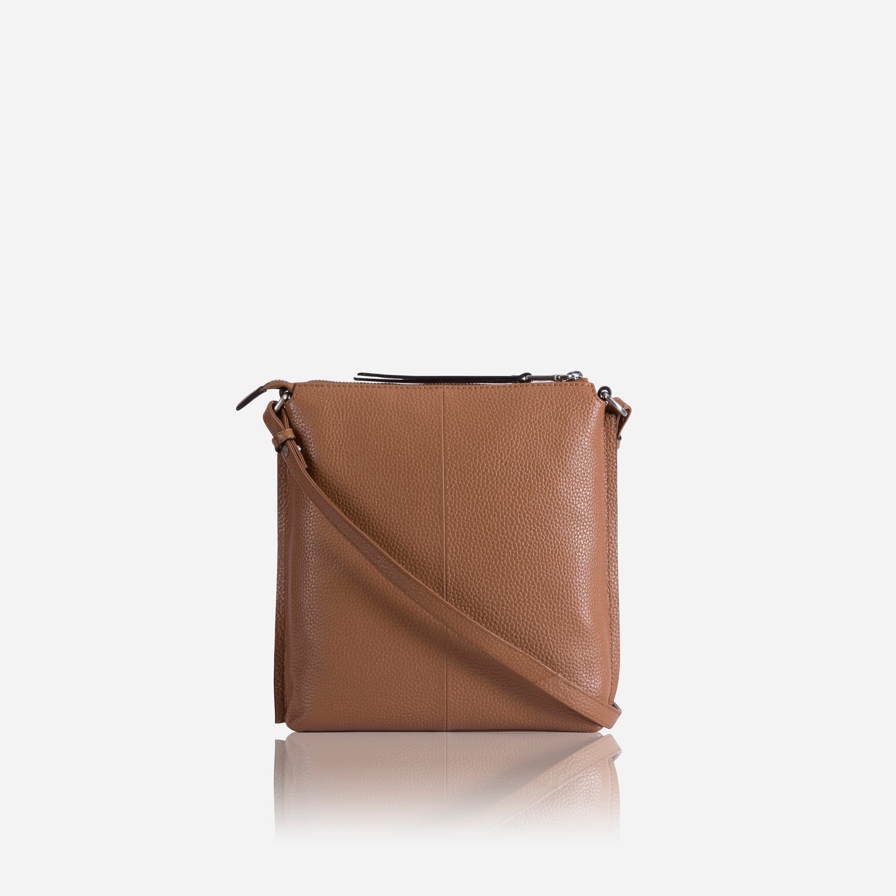 Essentials Crossbody Bag in Tan, featuring a sleek design and adjustable strap for comfort.