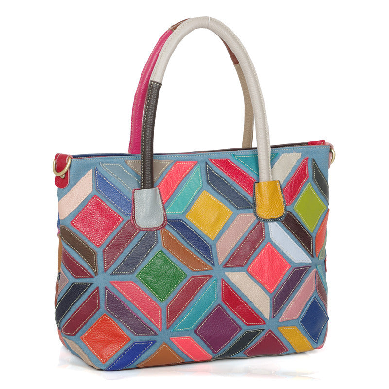 A colorful leather handbag featuring European American style with stitching details, medium size, and a zipper opening.