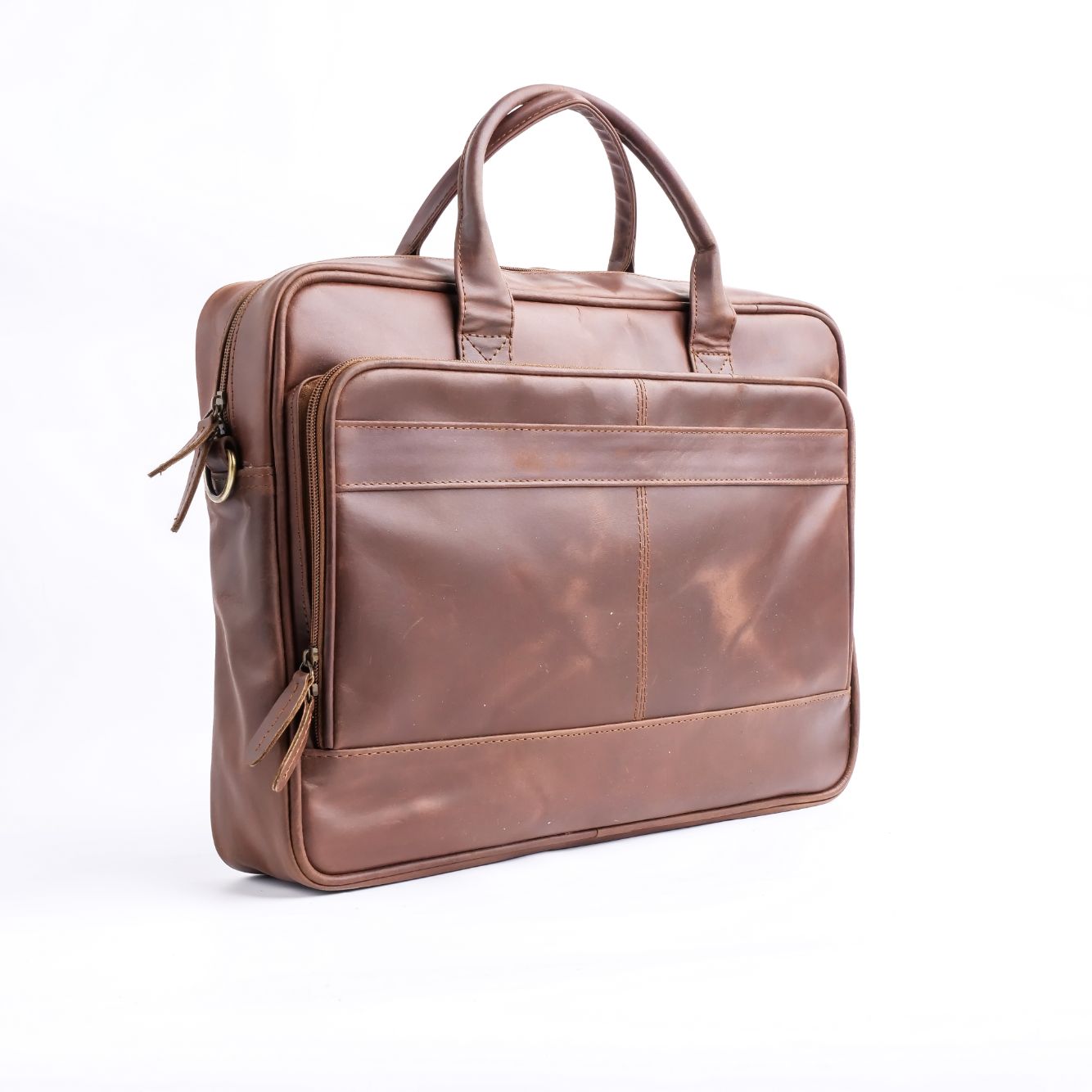 Tan brown leather laptop bag with vintage two-tone design, featuring adjustable shoulder strap and multiple compartments.