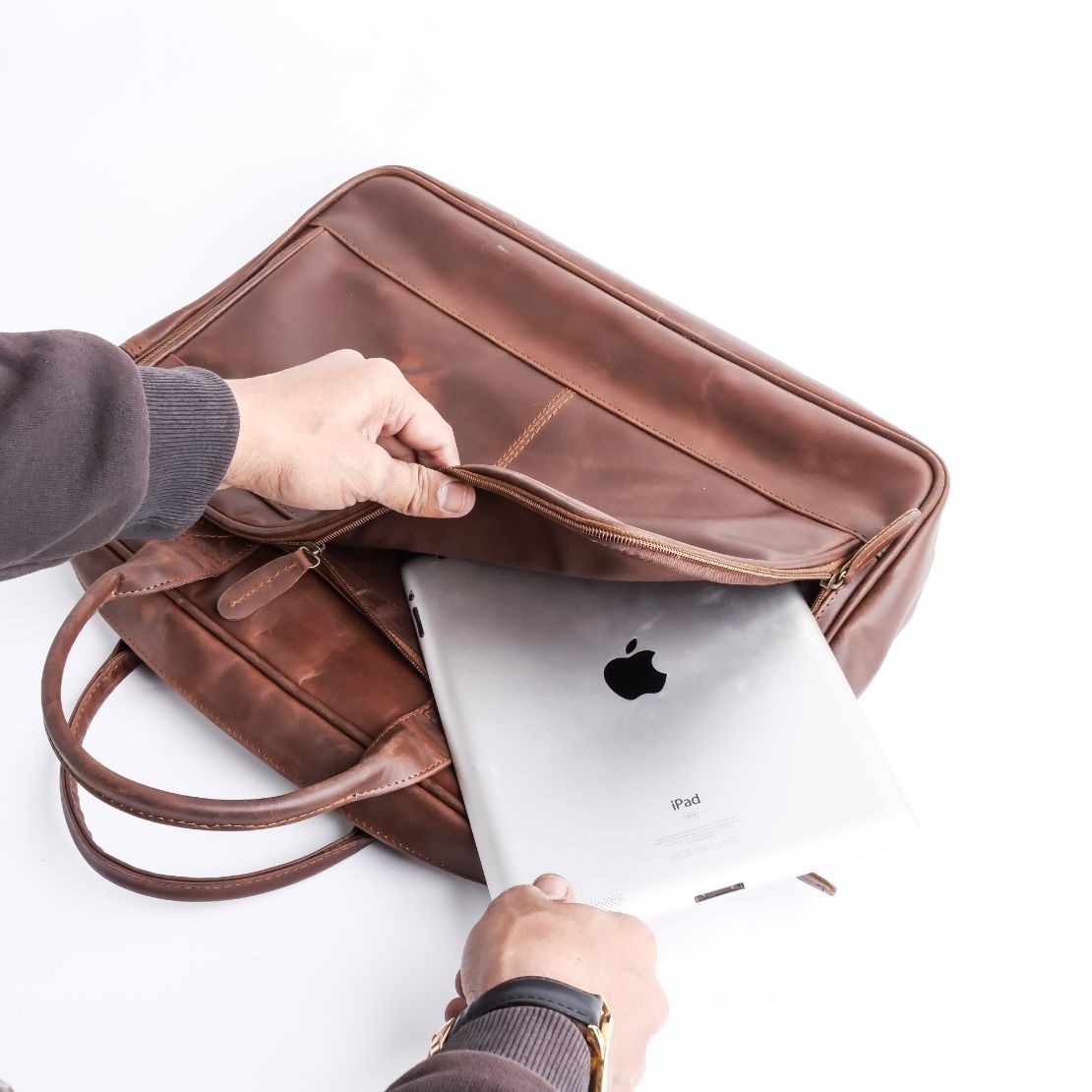 Tan brown leather laptop bag with vintage two-tone design, featuring adjustable shoulder strap and multiple compartments.