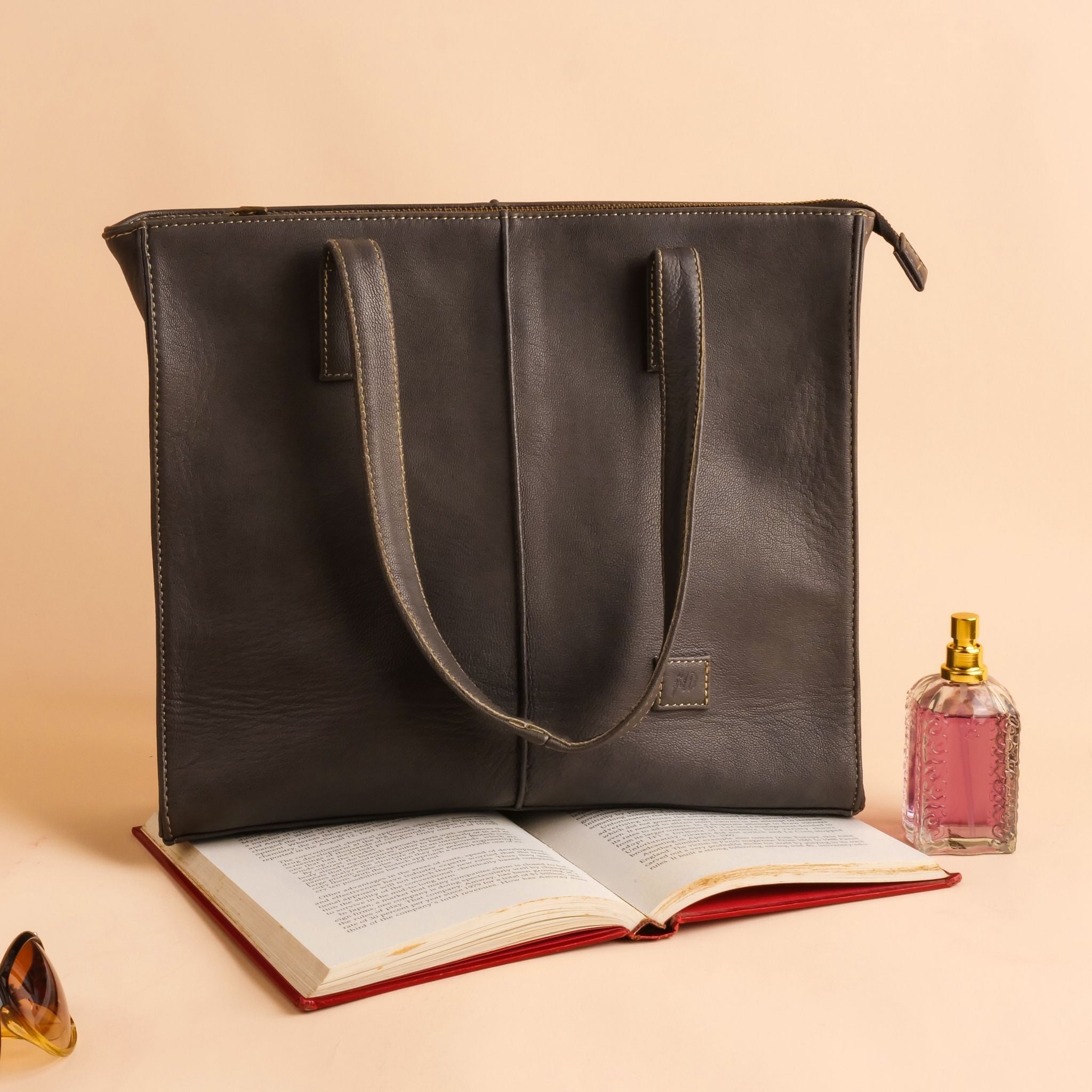 Everyday Women's Leather Zipper Tote Bag in Graphite Grey, showcasing its spacious design and premium cow leather material.