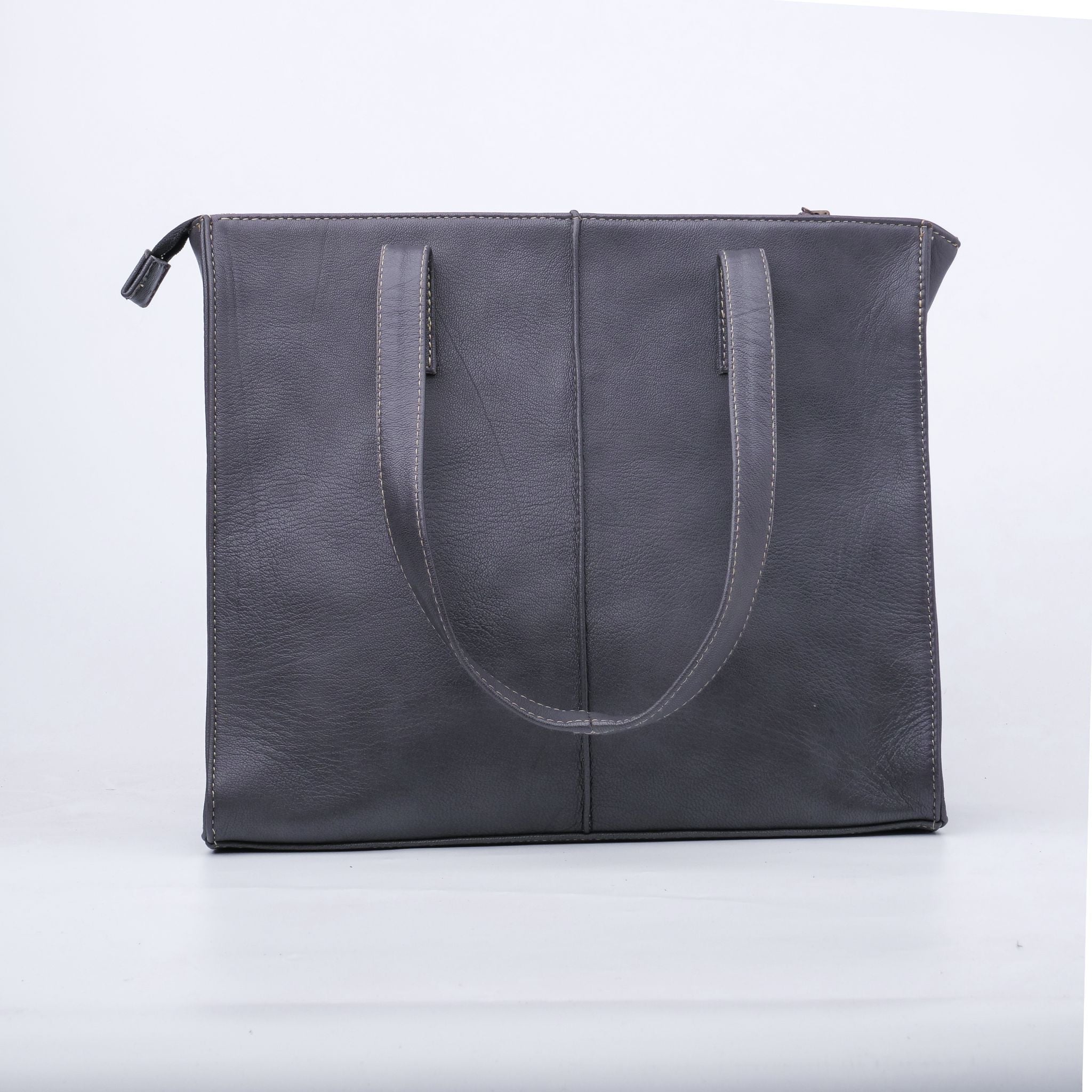 Everyday Women's Leather Zipper Tote Bag in Graphite Grey, showcasing its spacious design and premium cow leather material.