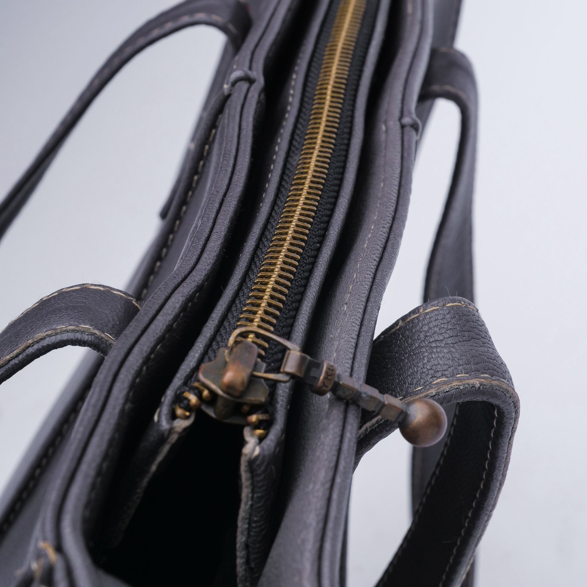 Everyday Women's Leather Zipper Tote Bag in Graphite Grey, showcasing its spacious design and premium cow leather material.