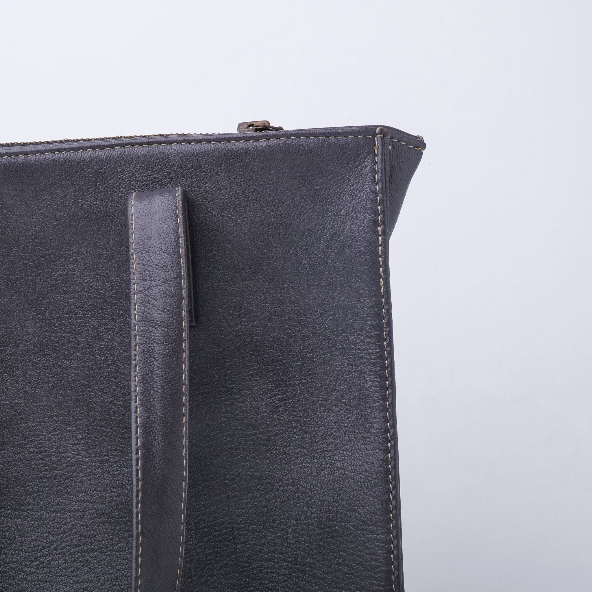 Everyday Women's Leather Zipper Tote Bag in Graphite Grey, showcasing its spacious design and premium cow leather material.