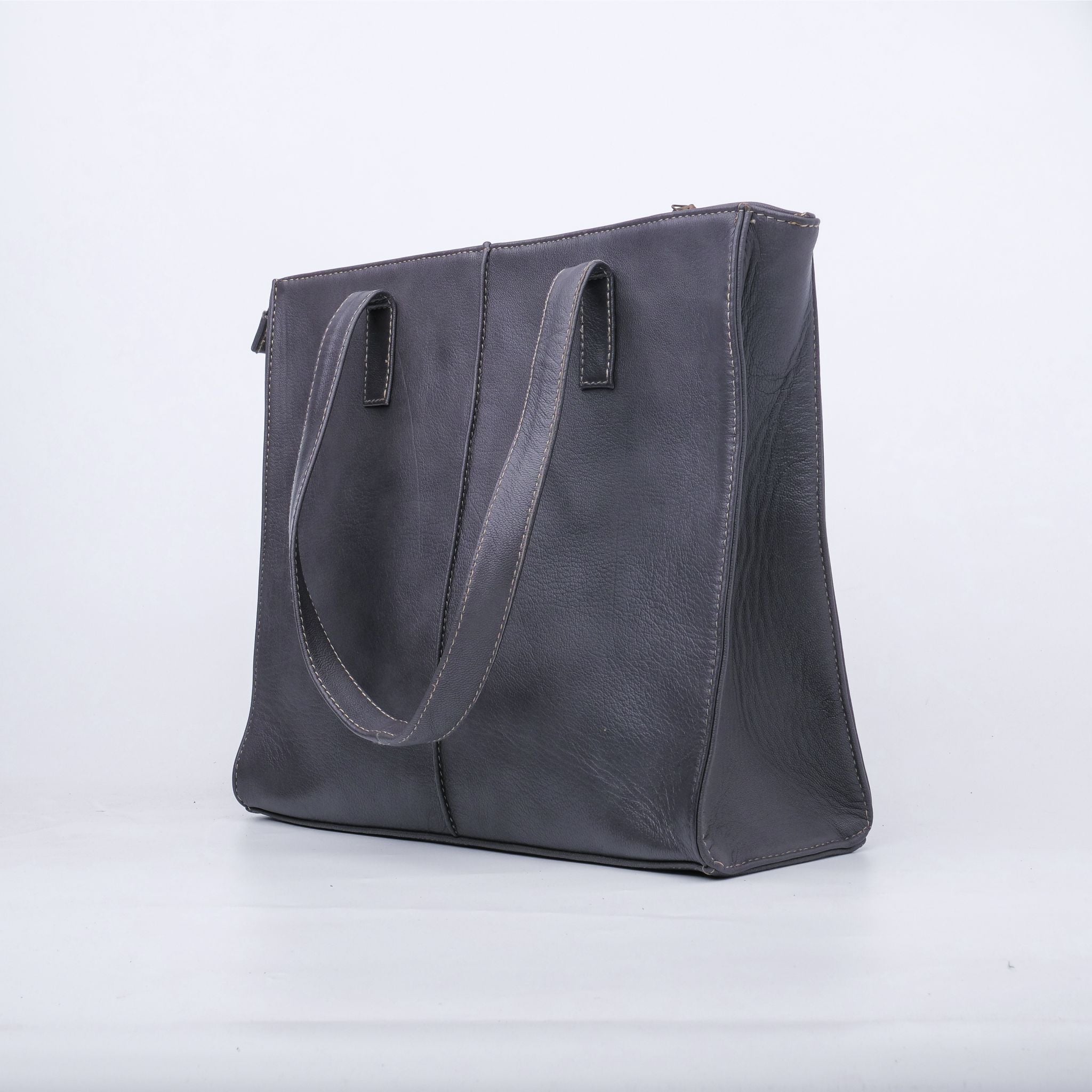 Everyday Women's Leather Zipper Tote Bag in Graphite Grey, showcasing its spacious design and premium cow leather material.