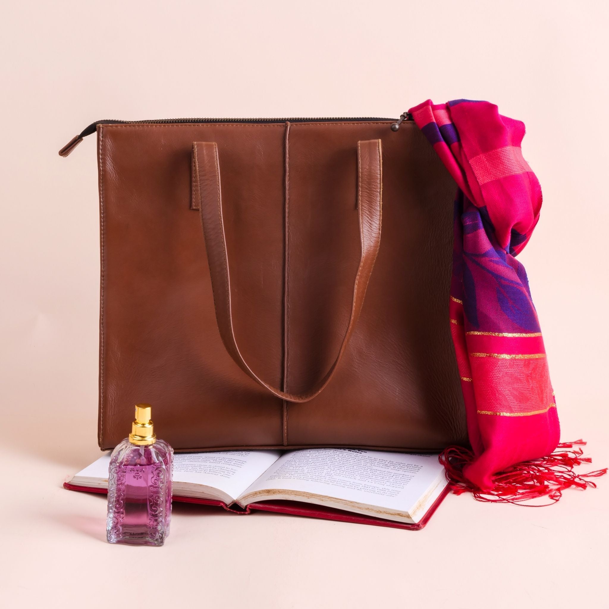 Everyday Women's Leather Zipper Tote Bag in Tan Brown, showcasing its spacious design and premium cow leather material.