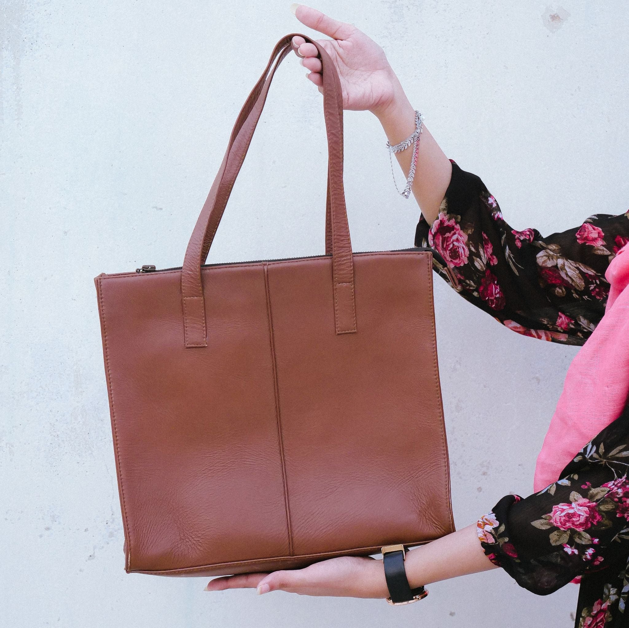 Everyday Women's Leather Zipper Tote Bag in Tan Brown, showcasing its spacious design and premium cow leather material.