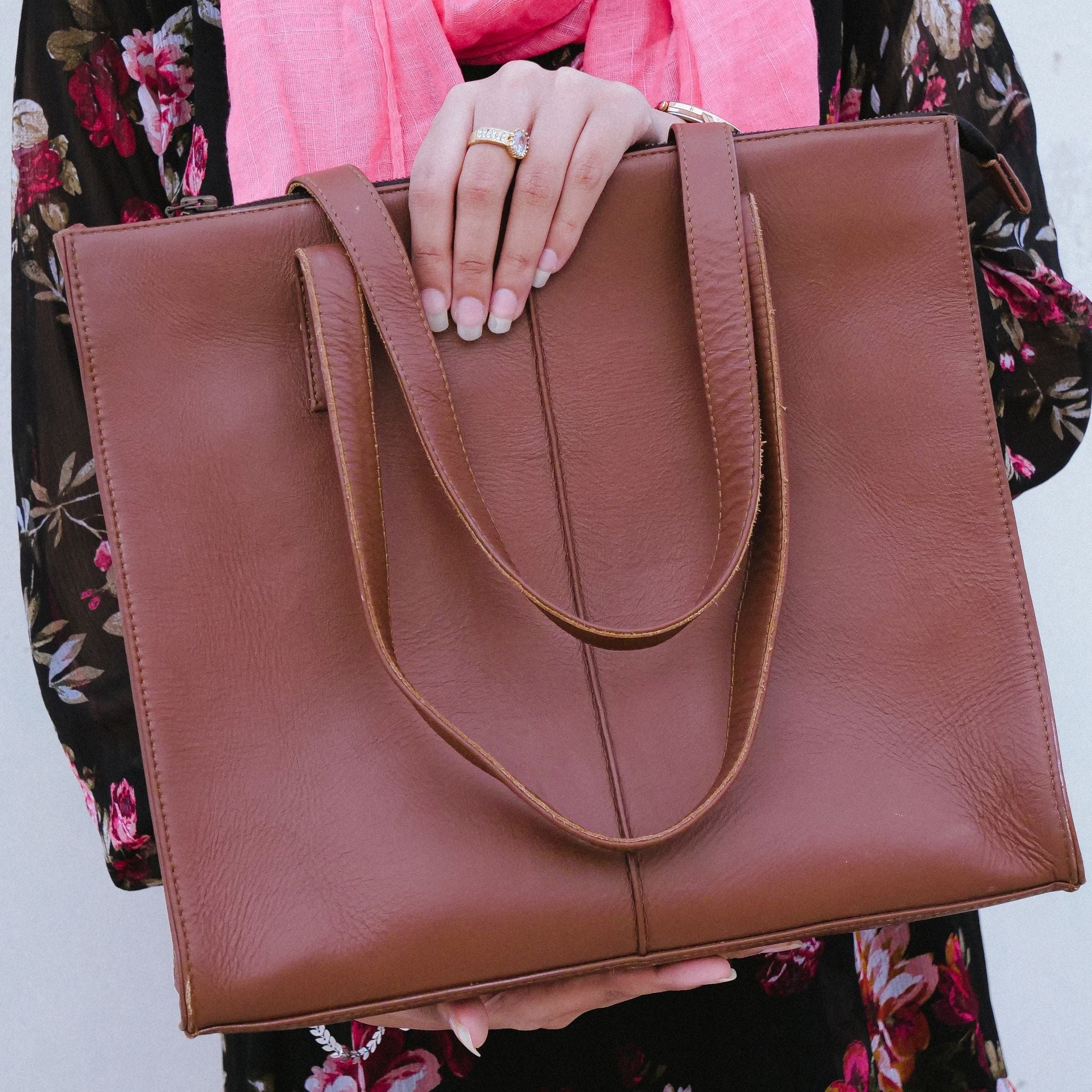 Everyday Women's Leather Zipper Tote Bag in Tan Brown, showcasing its spacious design and premium cow leather material.