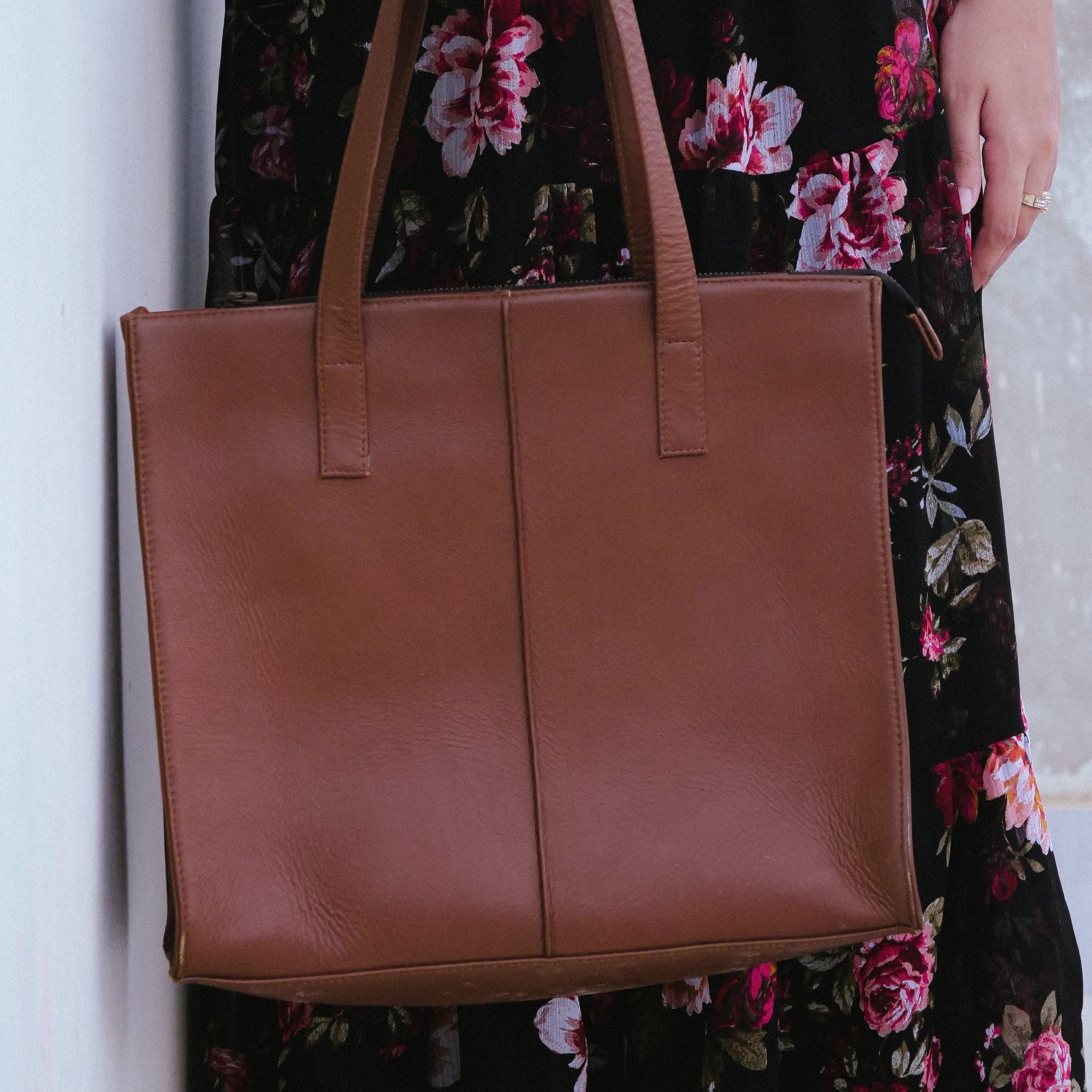 Everyday Women's Leather Zipper Tote Bag in Tan Brown, showcasing its spacious design and premium cow leather material.