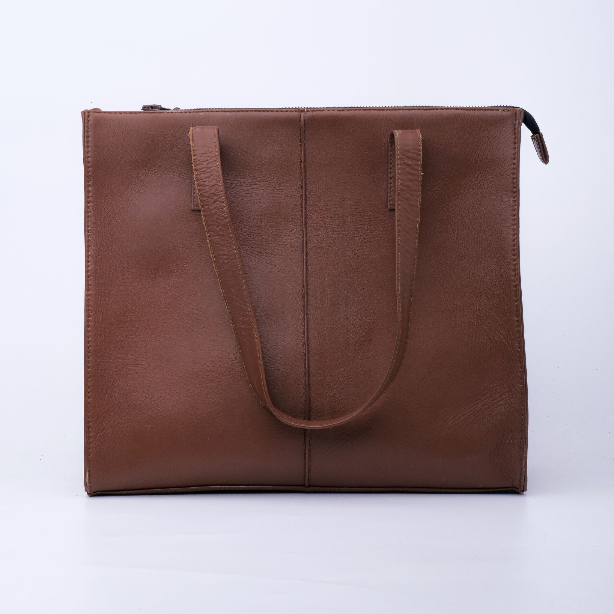 Everyday Women's Leather Zipper Tote Bag in Tan Brown, showcasing its spacious design and premium cow leather material.