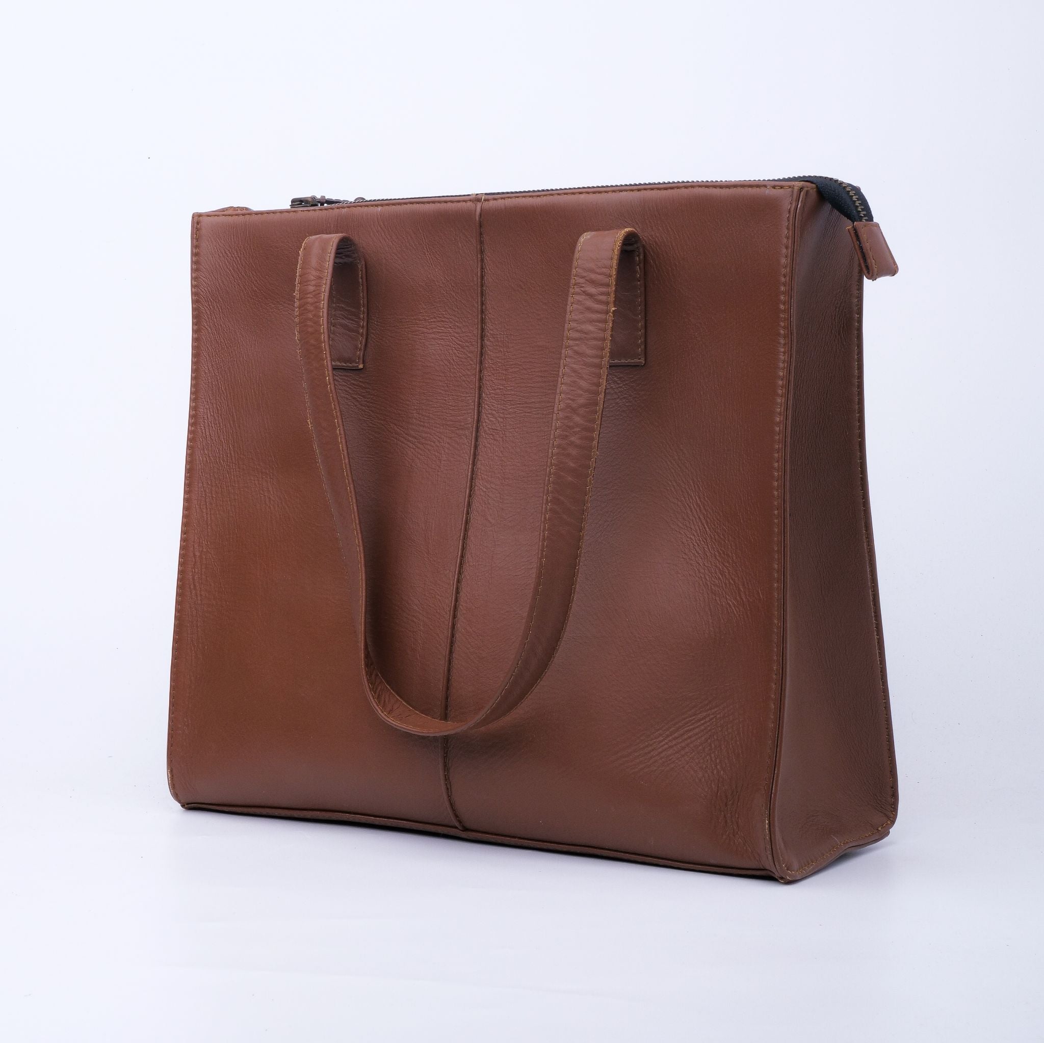 Everyday Women's Leather Zipper Tote Bag in Tan Brown, showcasing its spacious design and premium cow leather material.