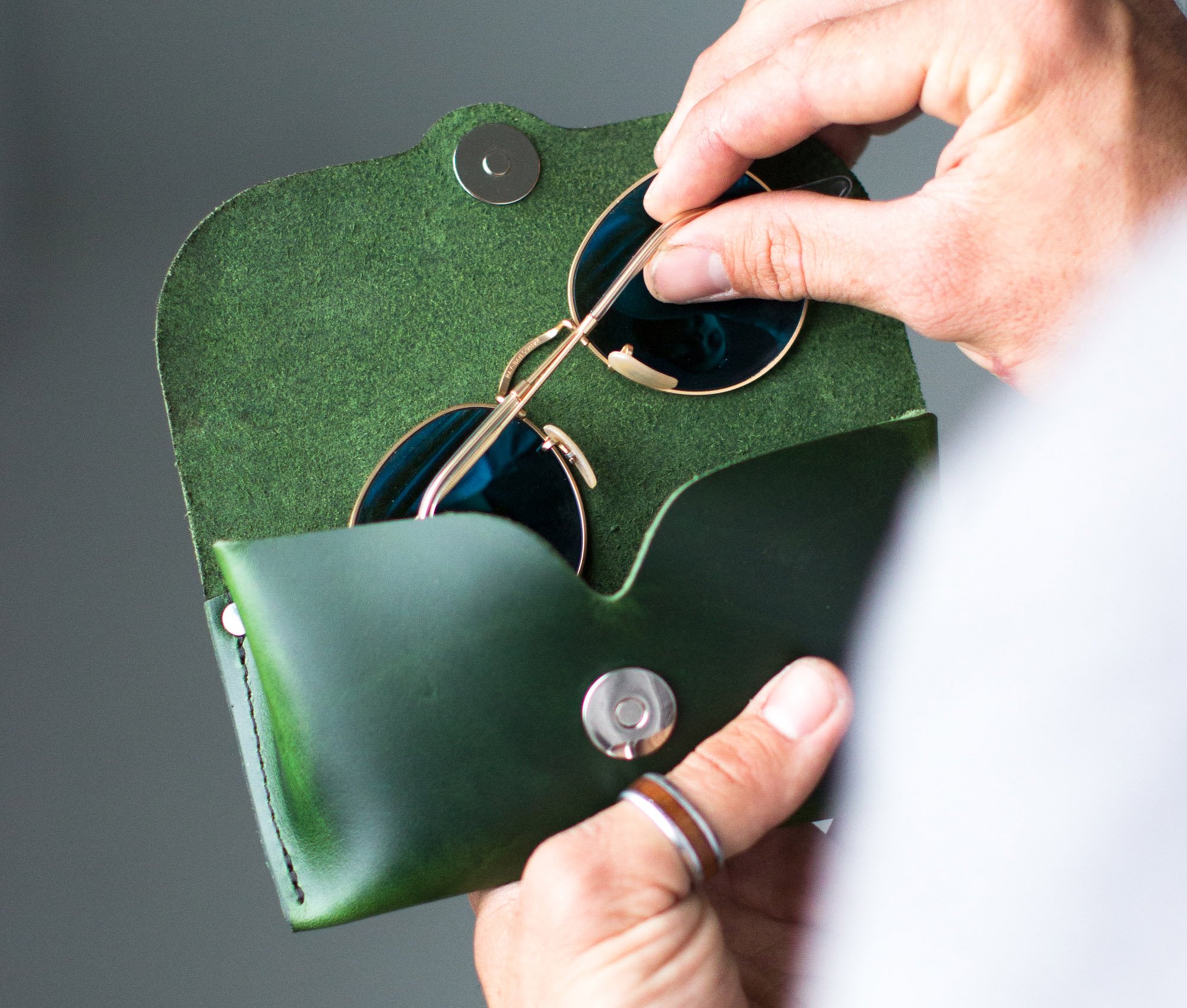 Premium leather eyeglasses case designed for universal fit, featuring a magnetic snap closure and personalized options.