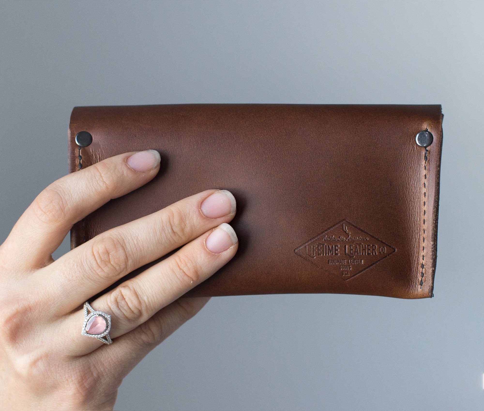 Premium leather eyeglasses case designed for universal fit, featuring a magnetic snap closure and personalized options.