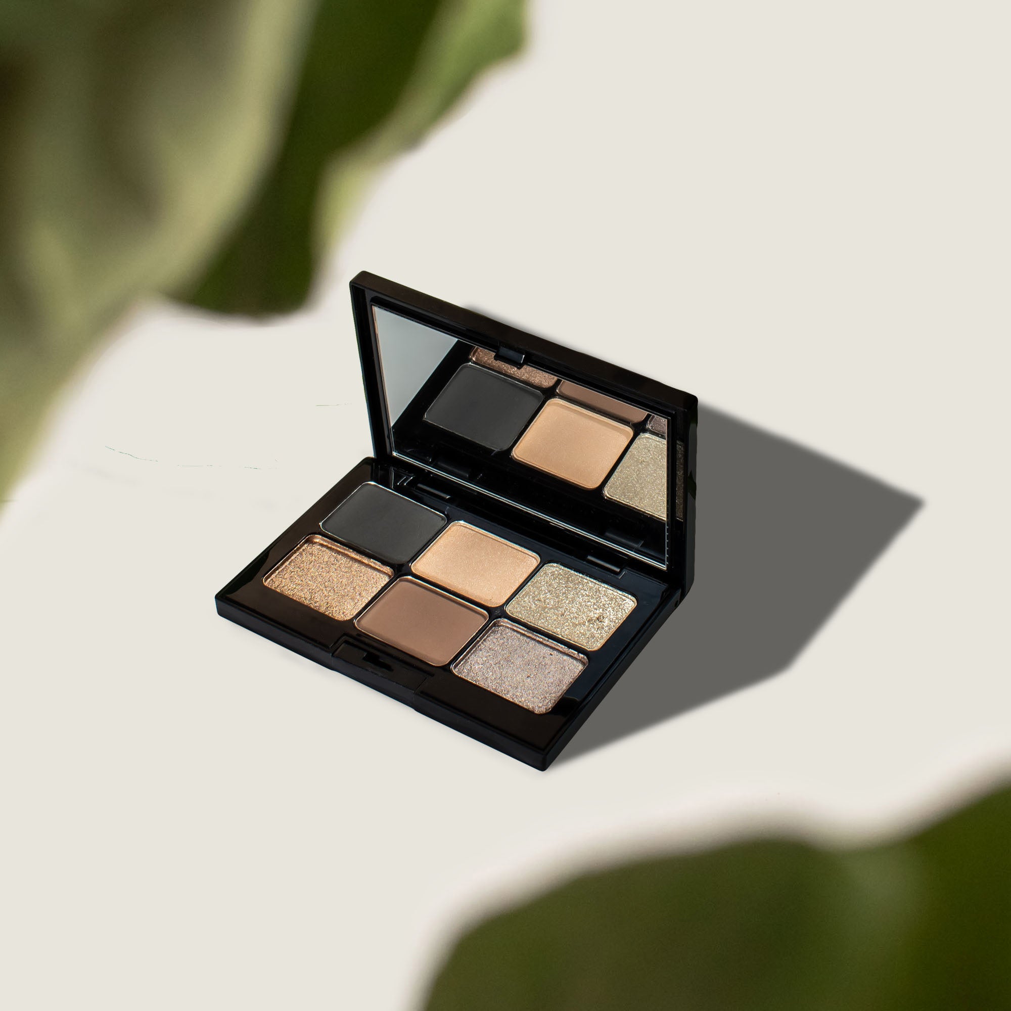 Dark Storm Eyeshadow Palette featuring 6 creamy shades in a sleek compact, ideal for creating vibrant eye looks.