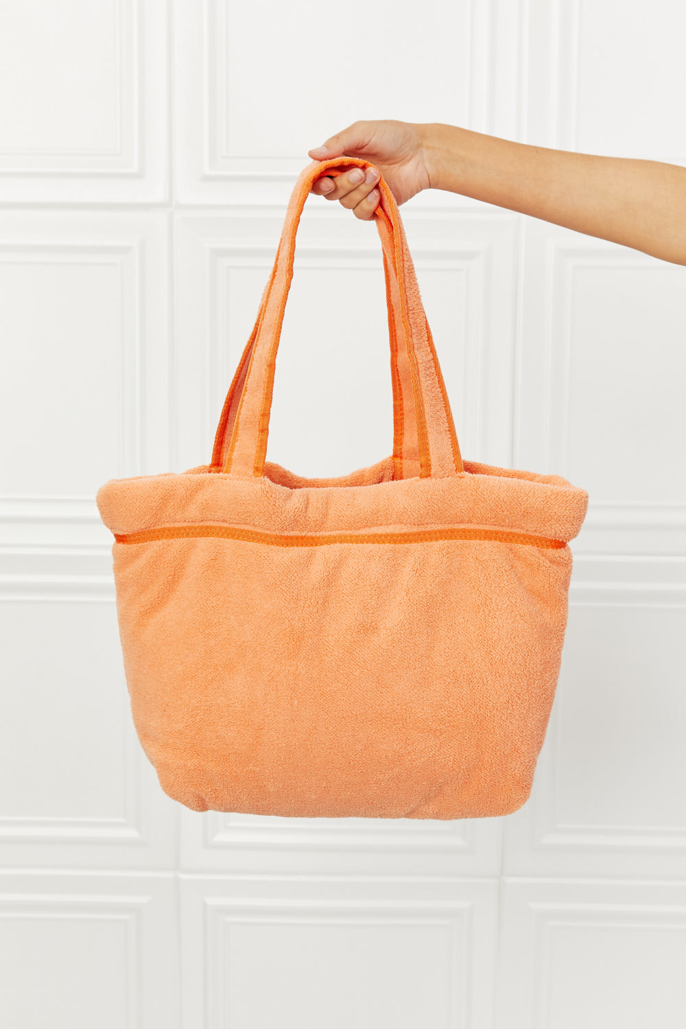 Vibrant orange Fame Found My Paradise Tote Bag with plush material, featuring zip and slip pockets, ideal for beach or pool use.