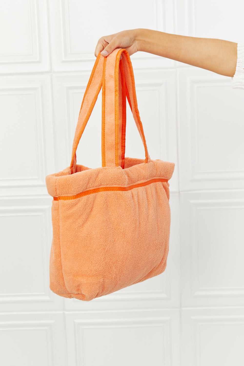 Vibrant orange Fame Found My Paradise Tote Bag with plush material, featuring zip and slip pockets, ideal for beach or pool use.