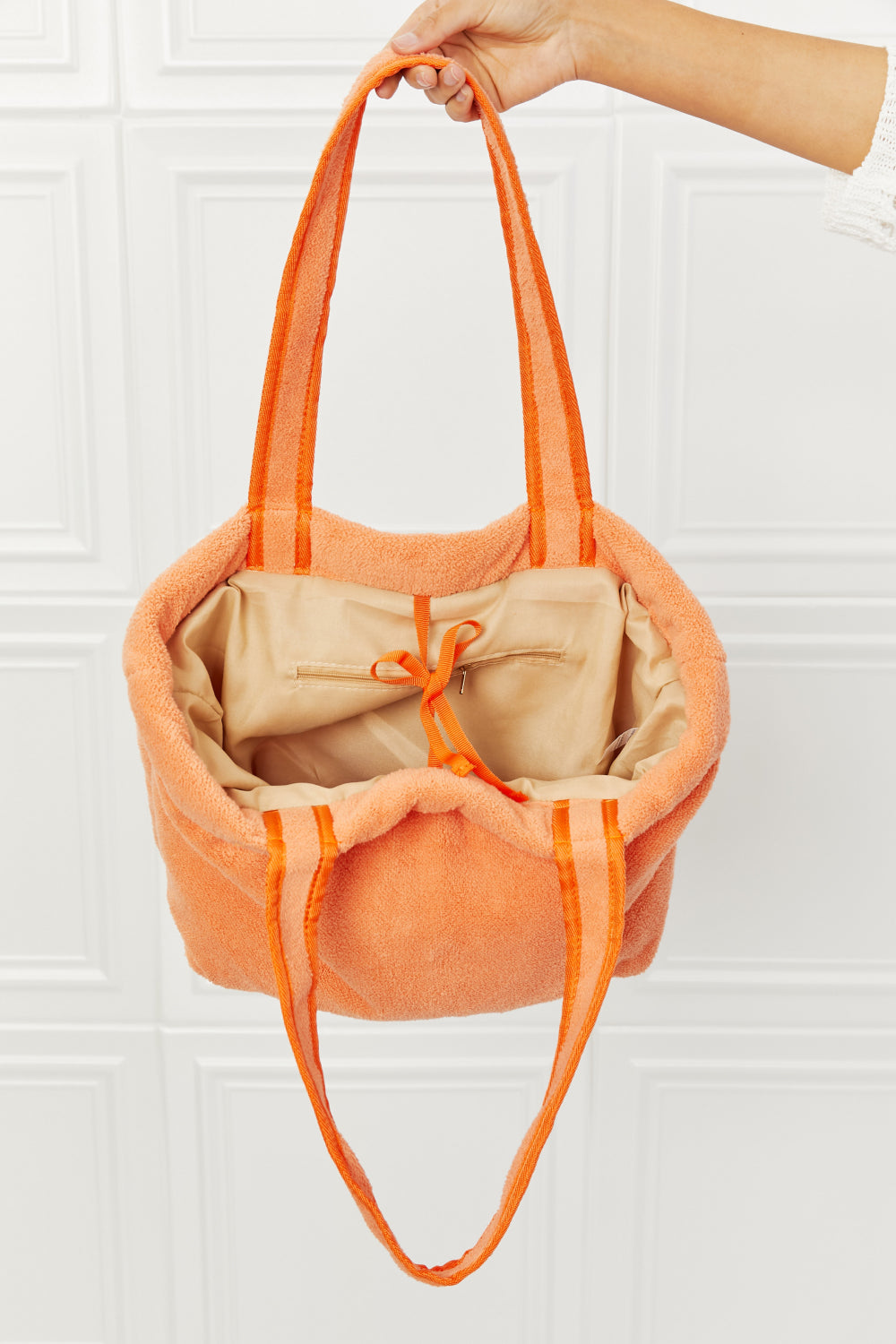 Vibrant orange Fame Found My Paradise Tote Bag with plush material, featuring zip and slip pockets, ideal for beach or pool use.