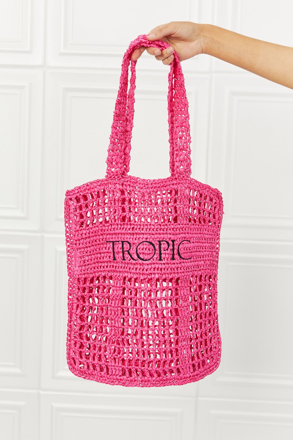 Fame Tropic Babe Straw Tote Bag in vibrant fuchsia with bold black lettering, perfect for summer outings.