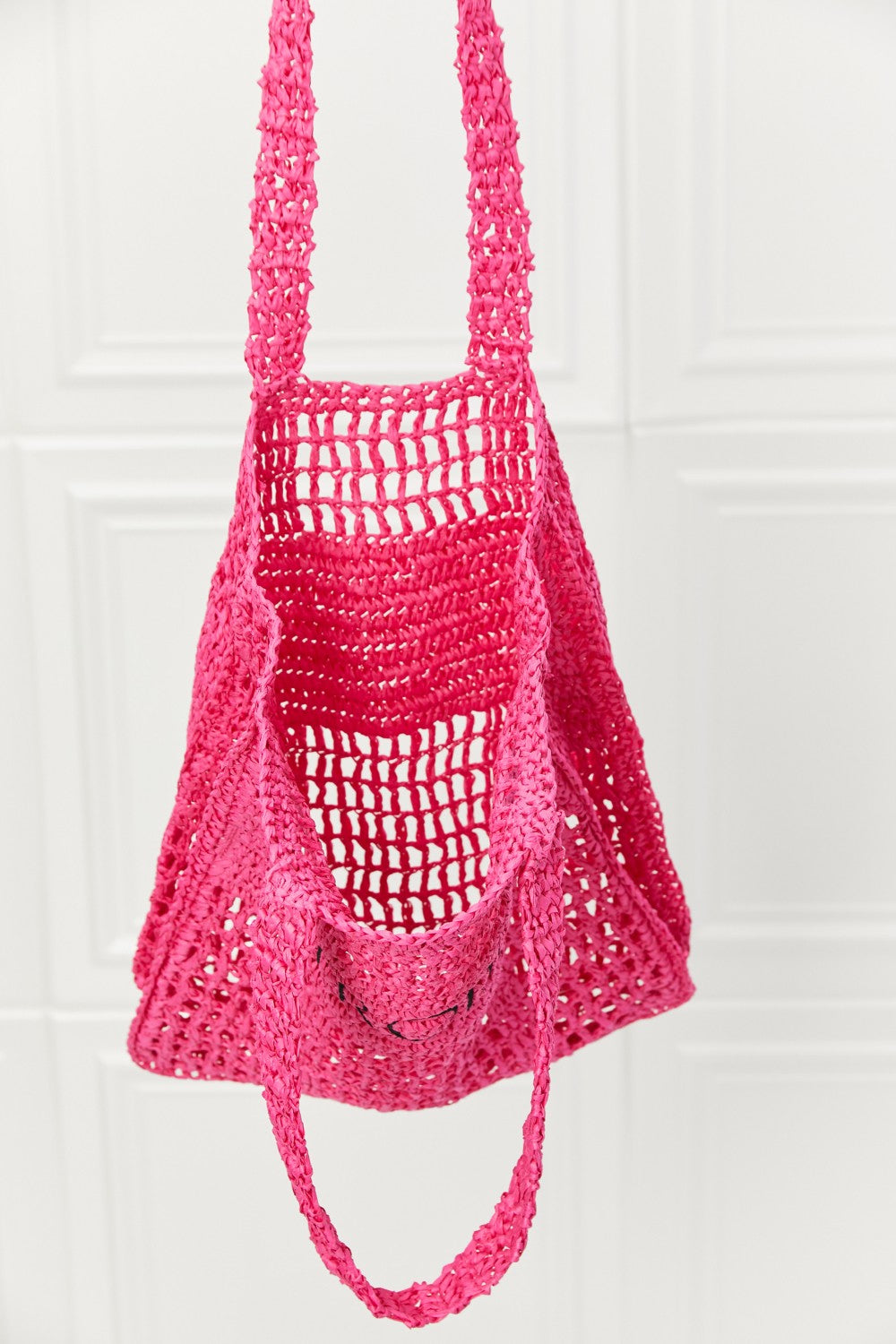 Fame Tropic Babe Straw Tote Bag in vibrant fuchsia with bold black lettering, perfect for summer outings.