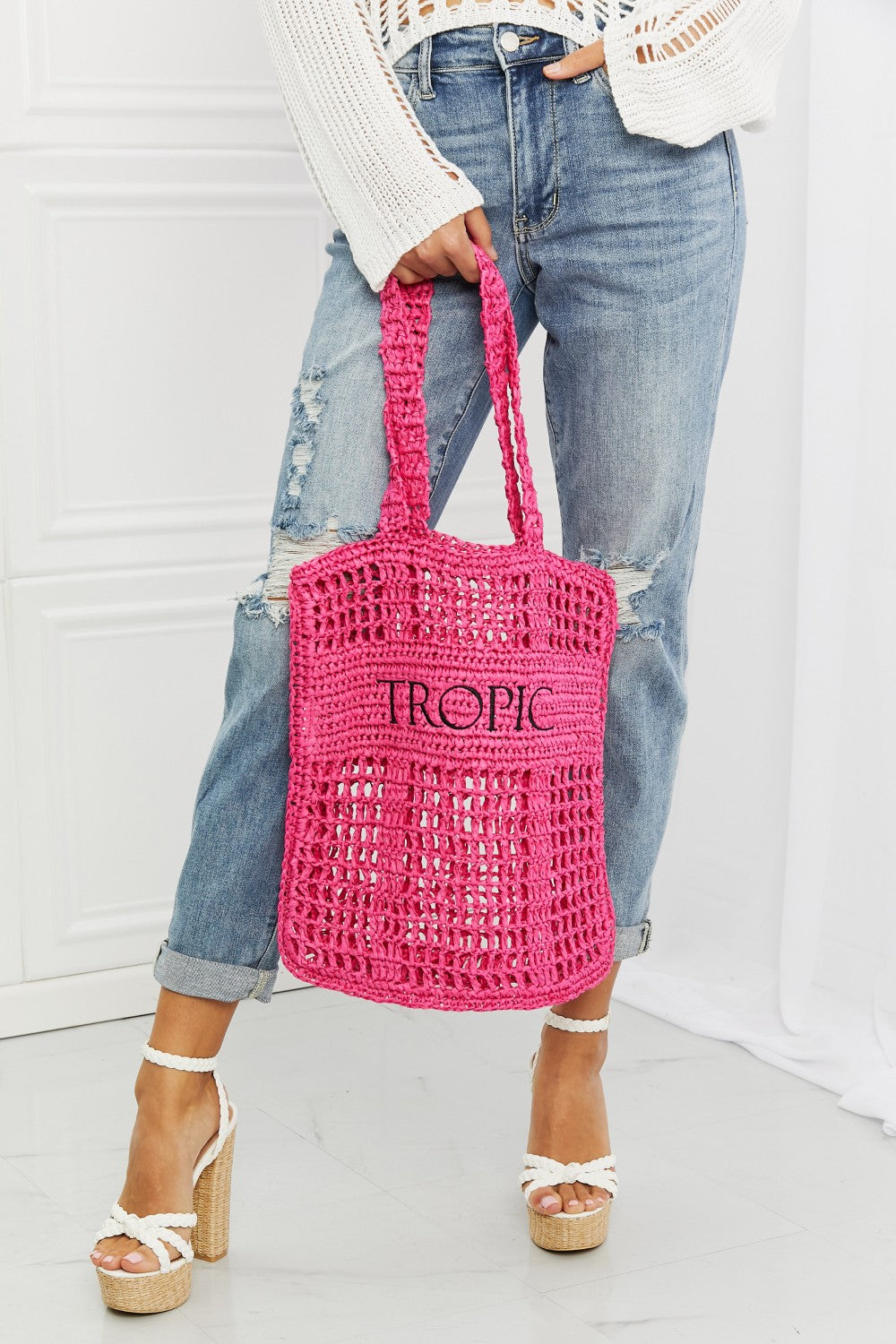 Fame Tropic Babe Straw Tote Bag in vibrant fuchsia with bold black lettering, perfect for summer outings.