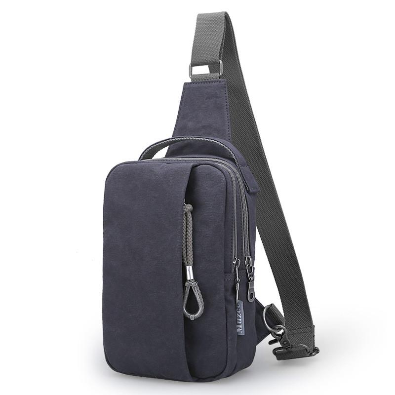 Fashion Casual Canvas Travel Chest Bag for Men, featuring multiple pockets and a soft handle, ideal for travel and daily use.