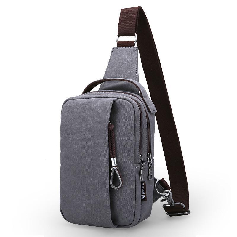 Fashion Casual Canvas Travel Chest Bag for Men, featuring multiple pockets and a soft handle, ideal for travel and daily use.