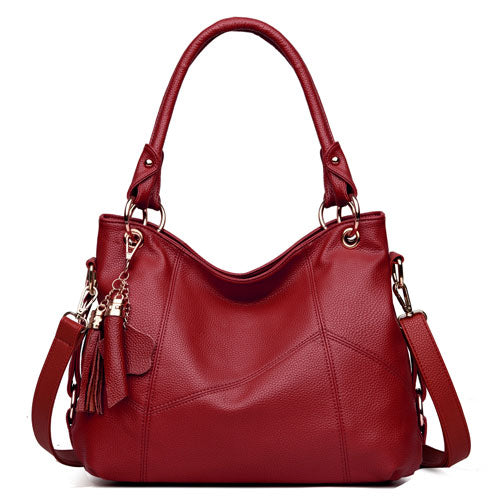 Fashionable one shoulder PU leather handbag for women, featuring a horizontal square shape and a stylish design.