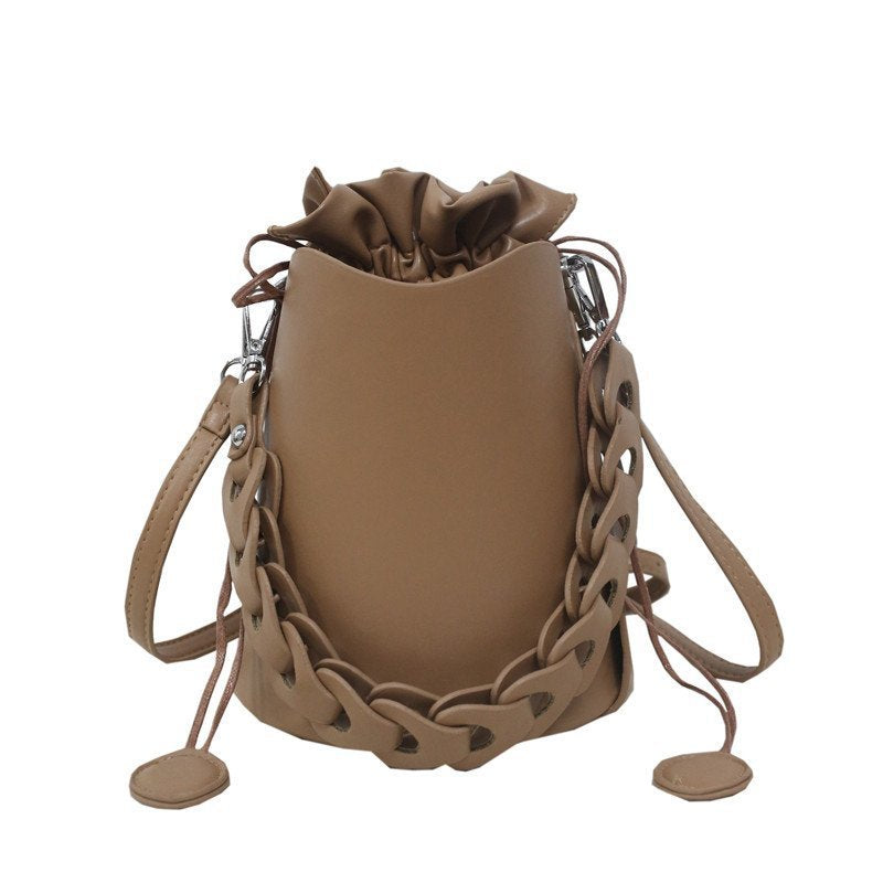 Fashion Solid Color Casual Female Bucket Messenger Bag in various colors with trendy belt decoration and car stitching.