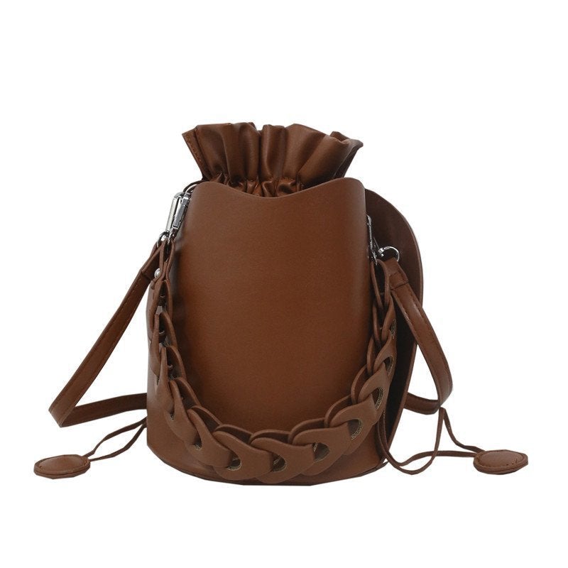 Fashion Solid Color Casual Female Bucket Messenger Bag in various colors with trendy belt decoration and car stitching.