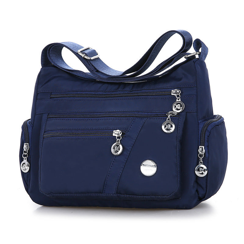 Fashion Solid Color Women's Casual Shoulder Messenger Bag made of durable Oxford cloth, featuring a single adjustable strap and medium size.