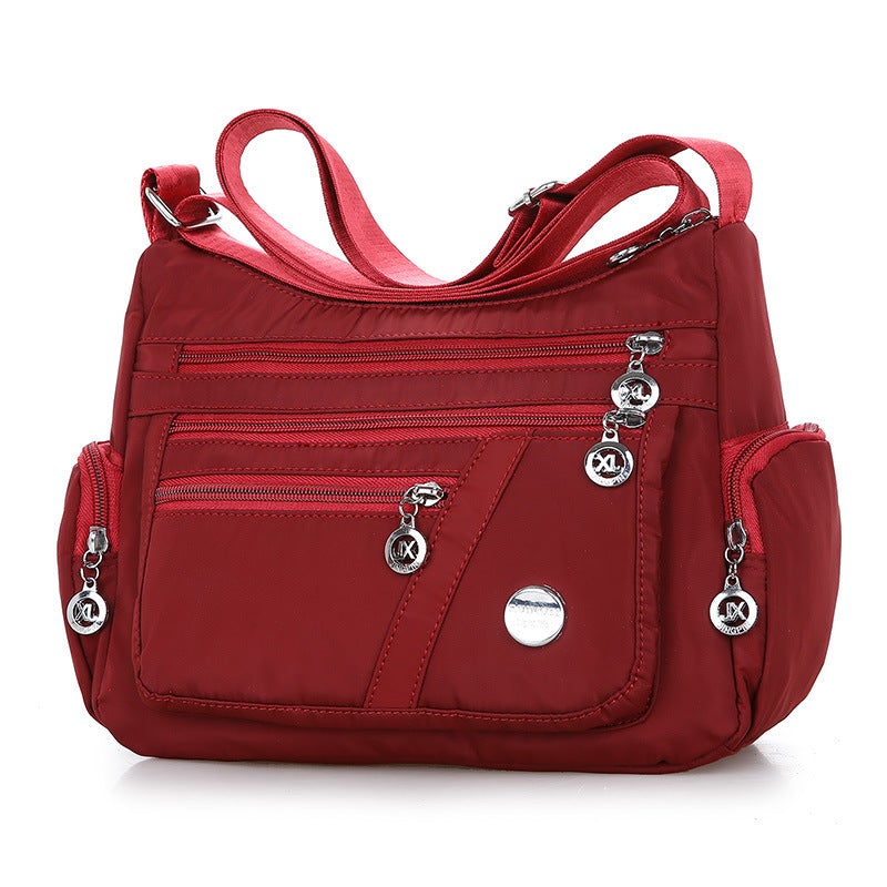 Fashion Solid Color Women's Casual Shoulder Messenger Bag made of durable Oxford cloth, featuring a single adjustable strap and medium size.