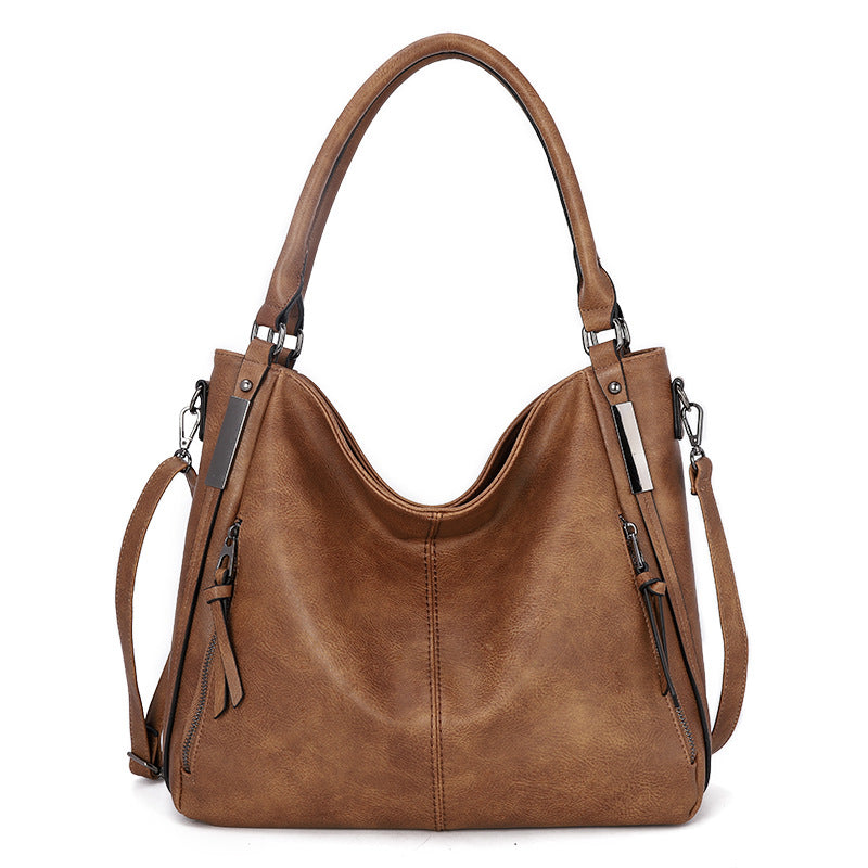 Fashionable large-capacity soft daily casual shoulder bag in stylish PU material, featuring a zipper closure and single strap design.