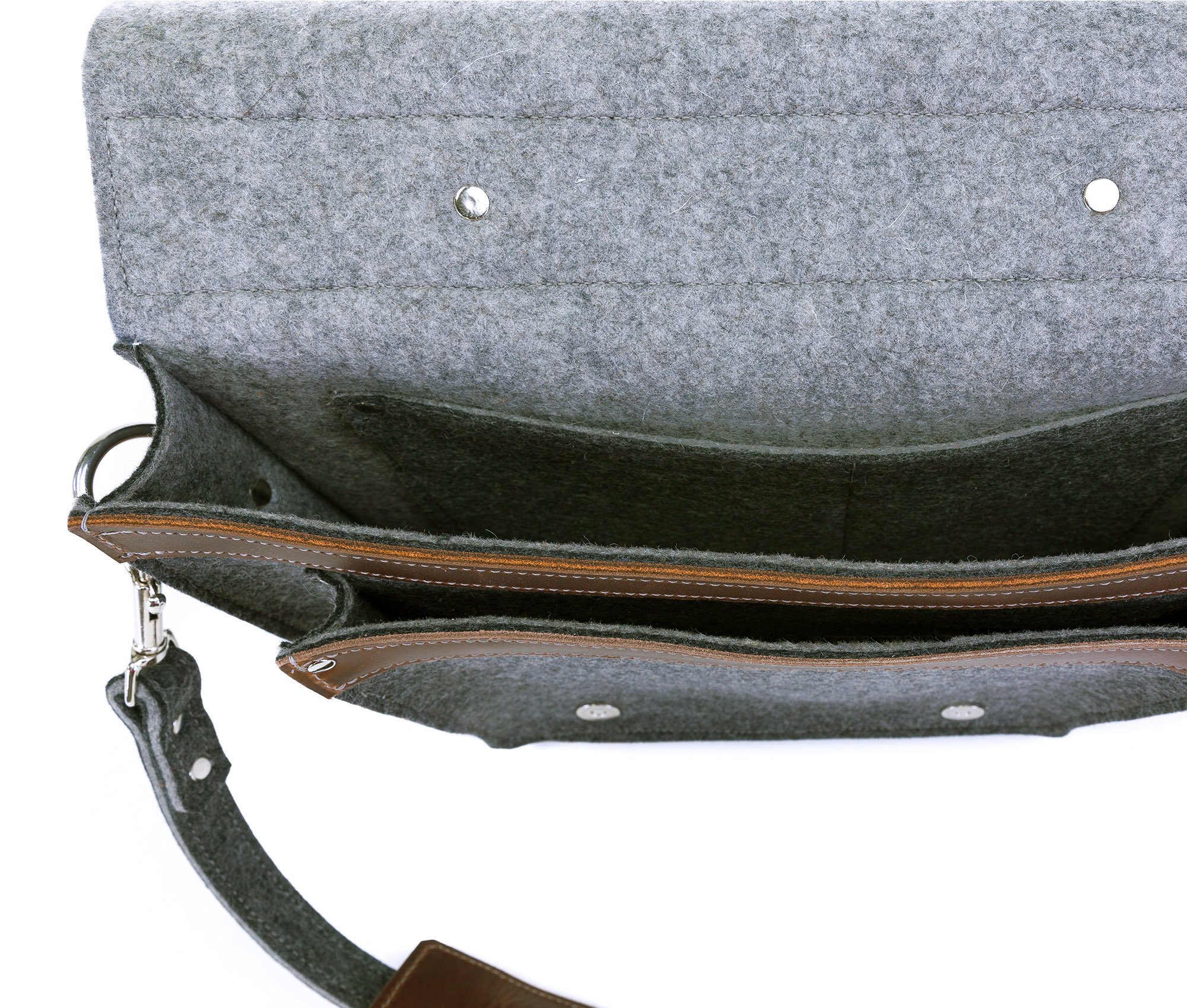 A stylish felt and leather messenger bag featuring silver hardware, adjustable strap, and multiple pockets for organization.