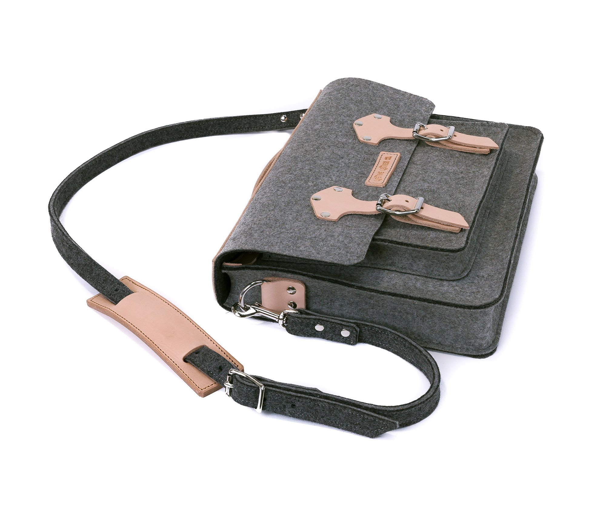 A stylish felt and leather messenger bag featuring silver hardware, adjustable strap, and multiple pockets for organization.