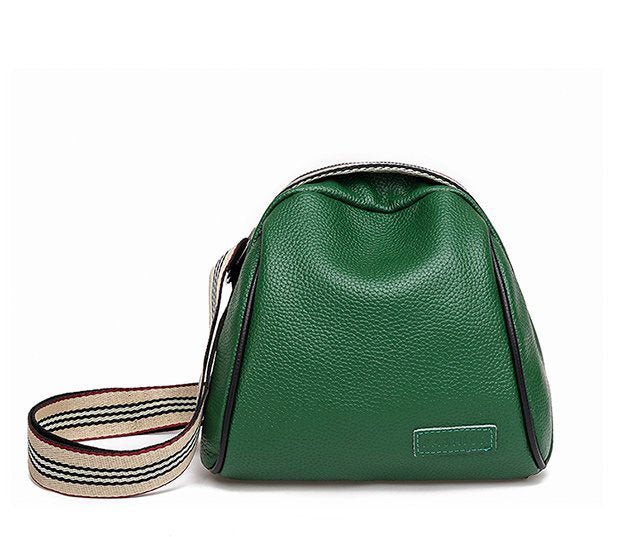 Female shell shape one-shoulder messenger bag made of PU leather with a zipper closure and single shoulder strap.