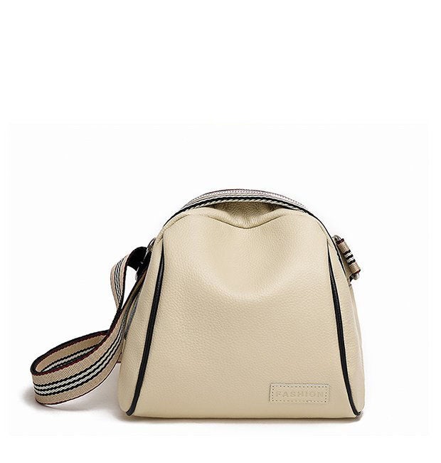 Female shell shape one-shoulder messenger bag made of PU leather with a zipper closure and single shoulder strap.