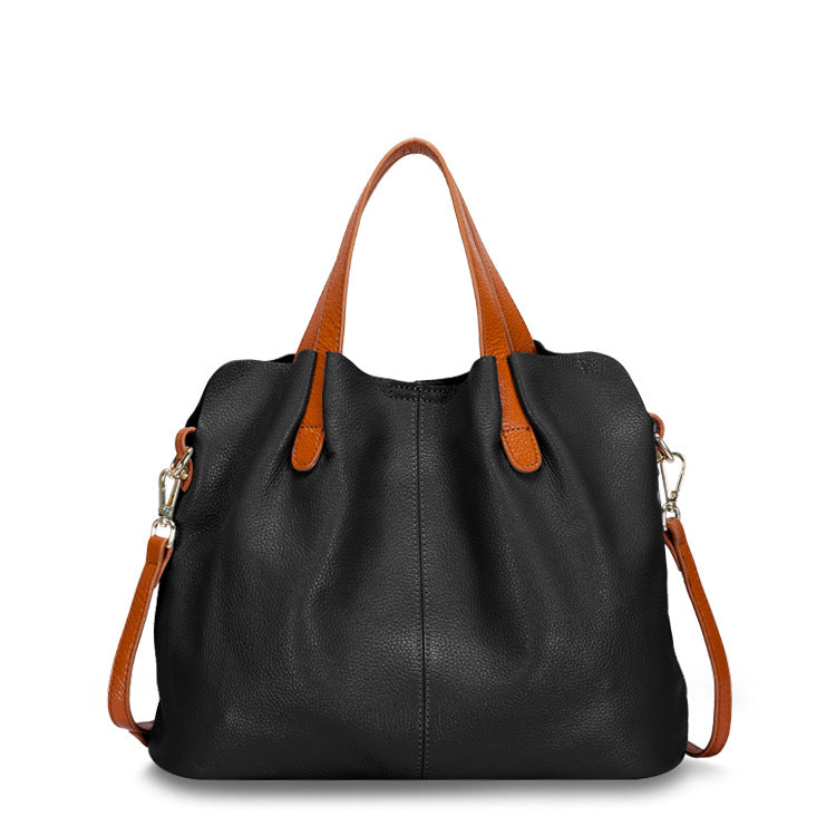 First Layer Cowhide Large Bag in elegant design, showcasing its soft leather texture and spacious interior with multiple pockets.