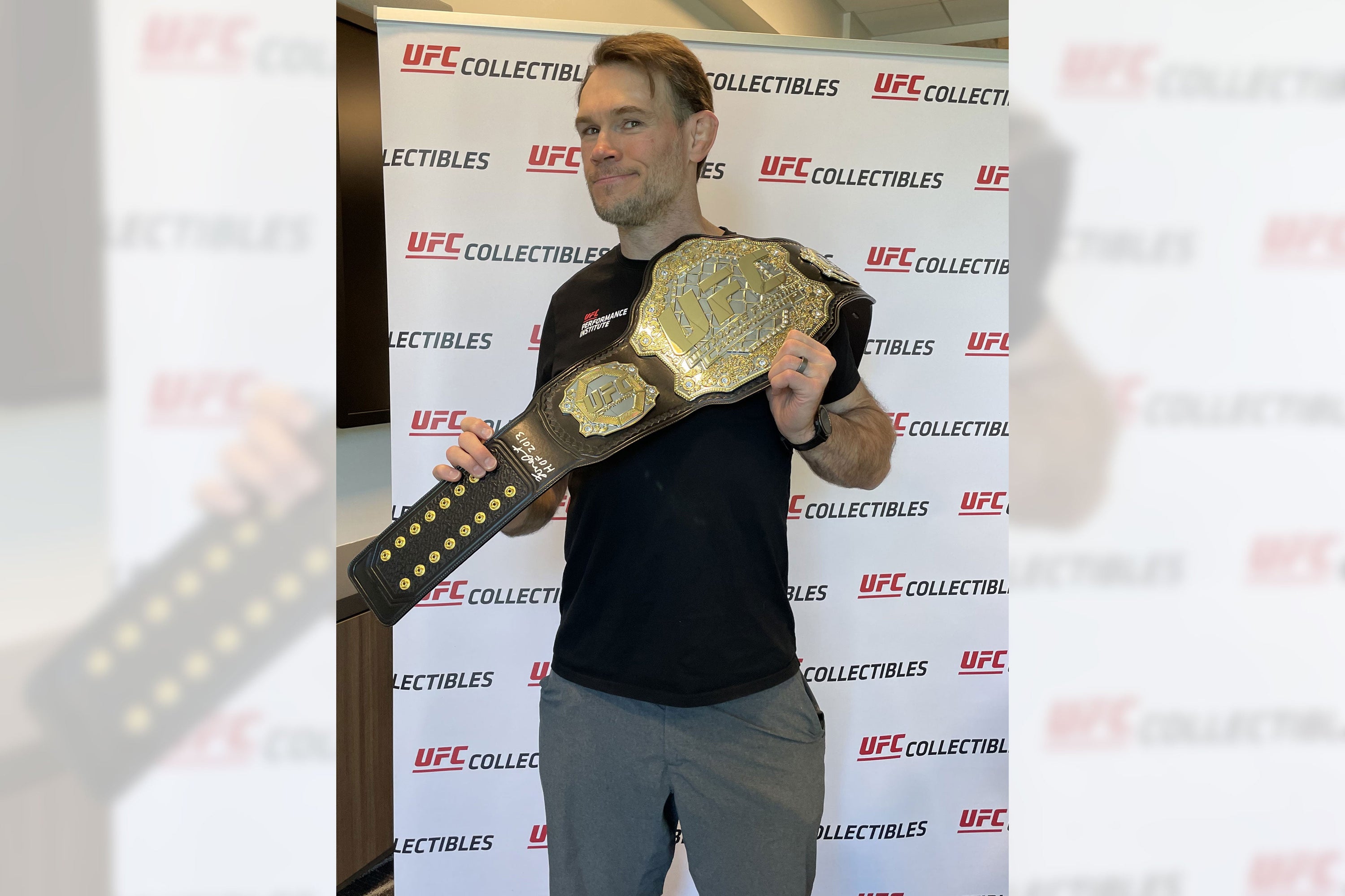 Forrest Griffin Signed UFC Replica Classic Championship Belt displayed elegantly, showcasing its detailed design and autograph.