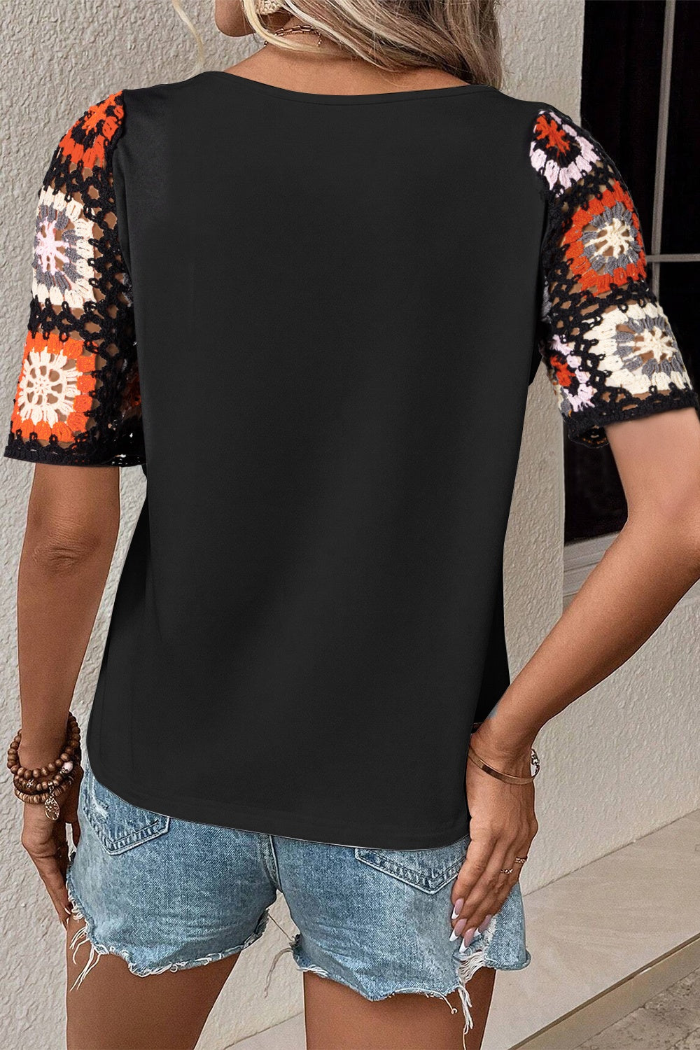 Geometric Round Neck Short Sleeve Blouse in a stylish design, showcasing its modern pattern and comfortable fit.