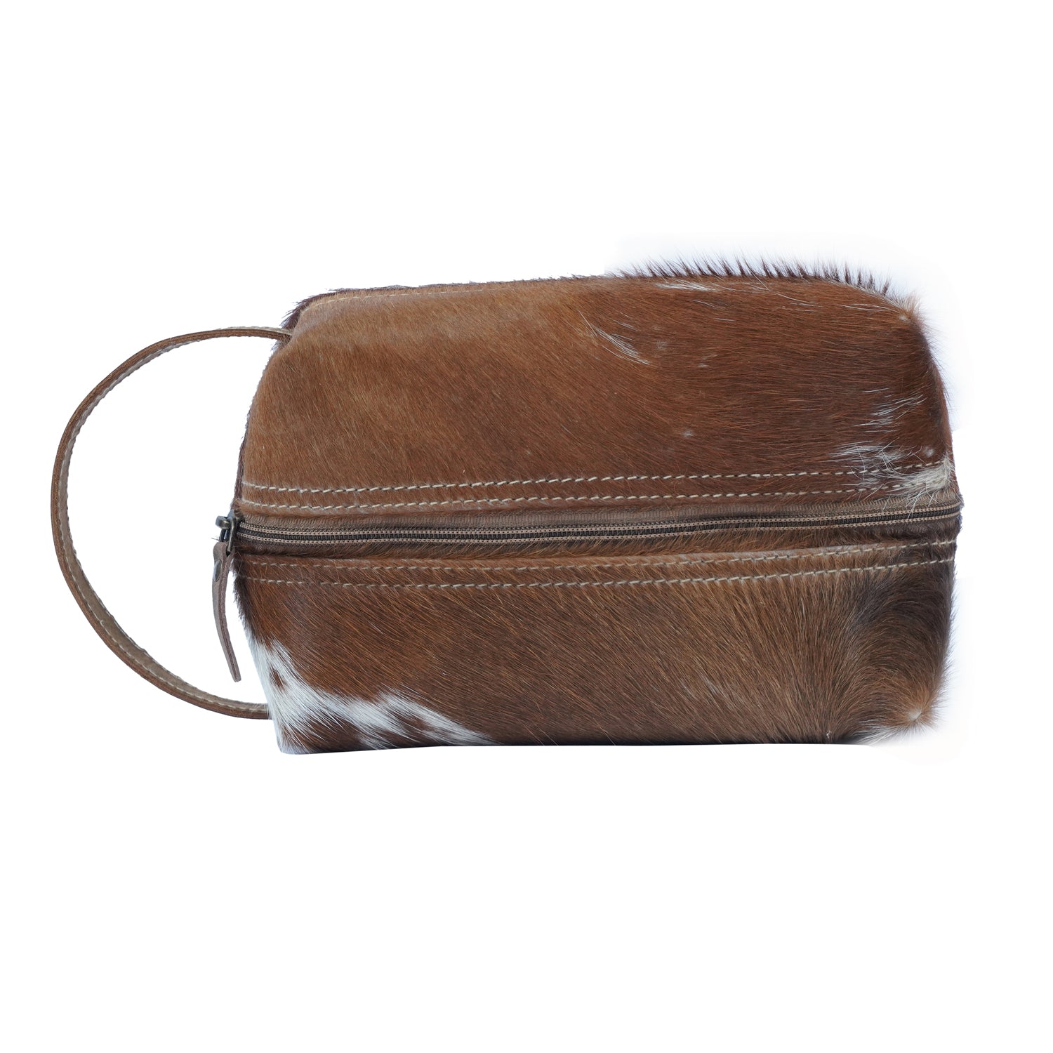 Gerio Dopp Kit handcrafted from hairon and leather with a zipped closure, showcasing its vintage and classic design.