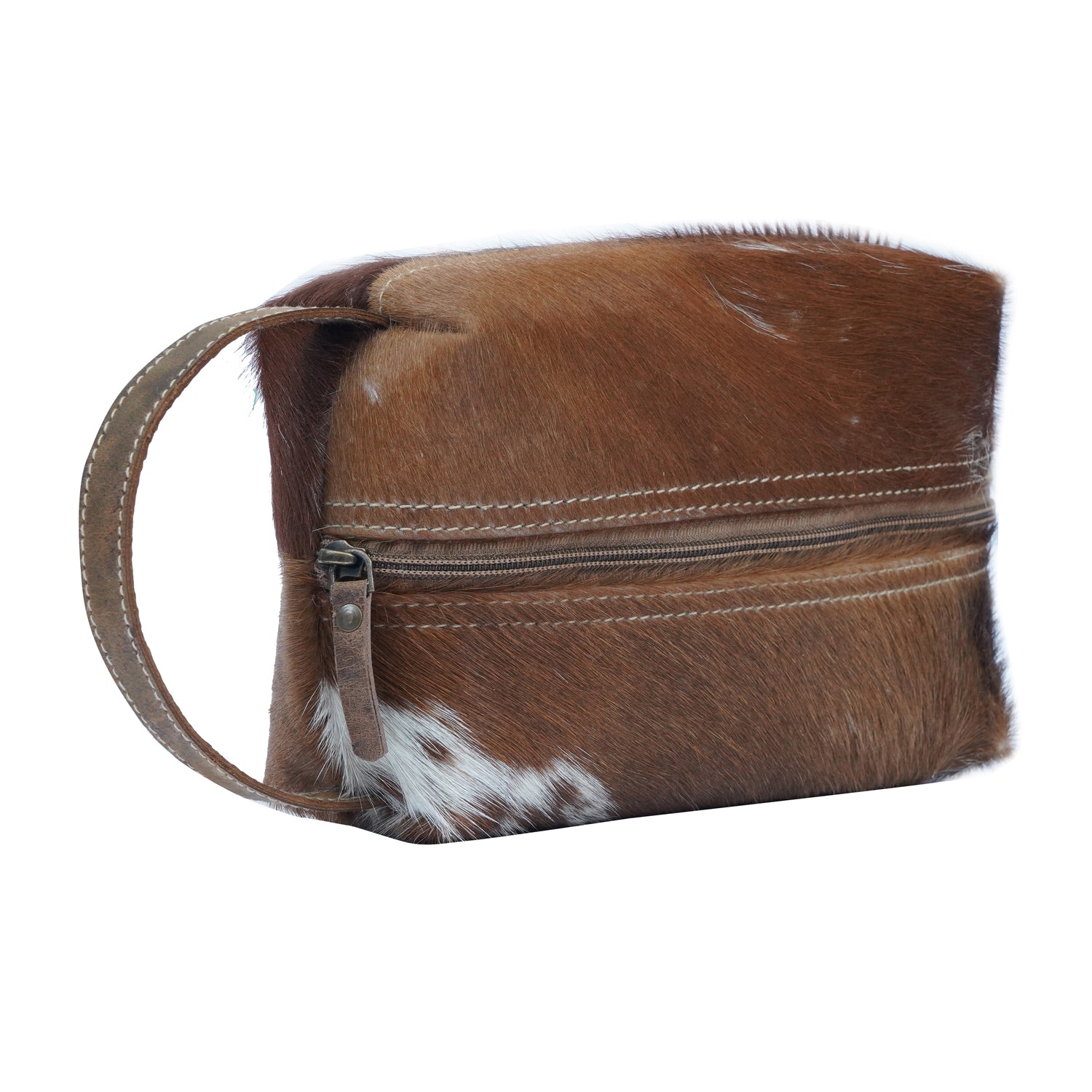 Gerio Dopp Kit handcrafted from hairon and leather with a zipped closure, showcasing its vintage and classic design.