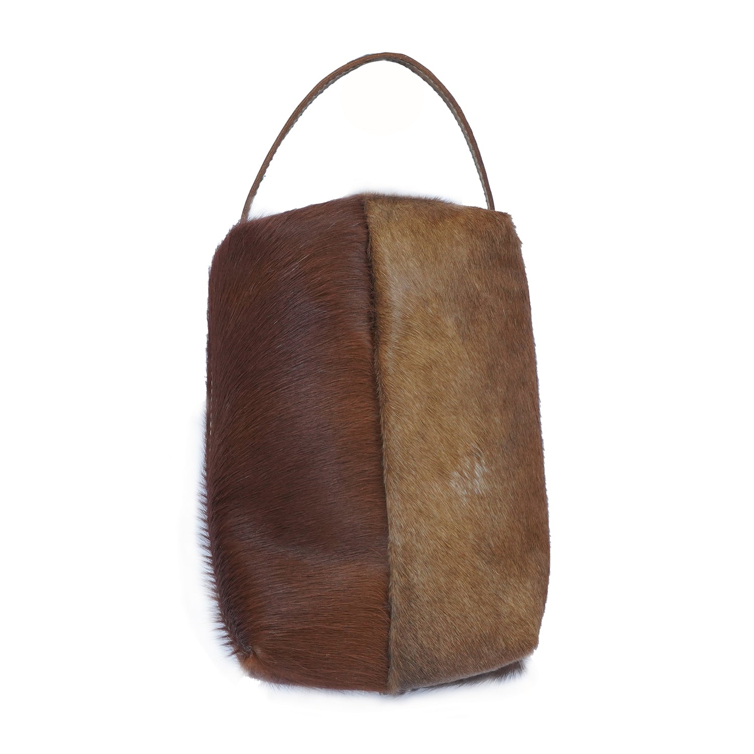 Gerio Dopp Kit handcrafted from hairon and leather with a zipped closure, showcasing its vintage and classic design.