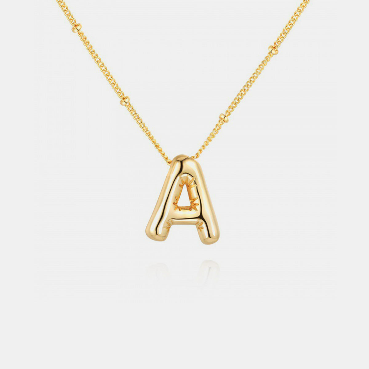 Gold-Plated Letter Pendant Necklace featuring a personalized letter charm on a delicate chain.